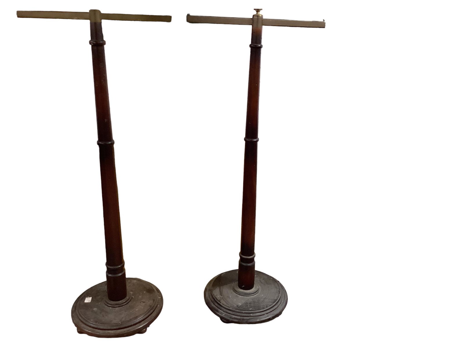 2 heavy store walnut clothing racks. The arm height measuring 57 1/2” and the arms are (1 of 1)