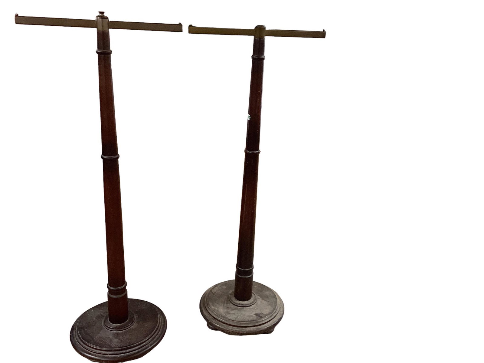 2 heavy store walnut clothing racks. The arm height measuring 57 1/2” and the arms are (1 of 1)