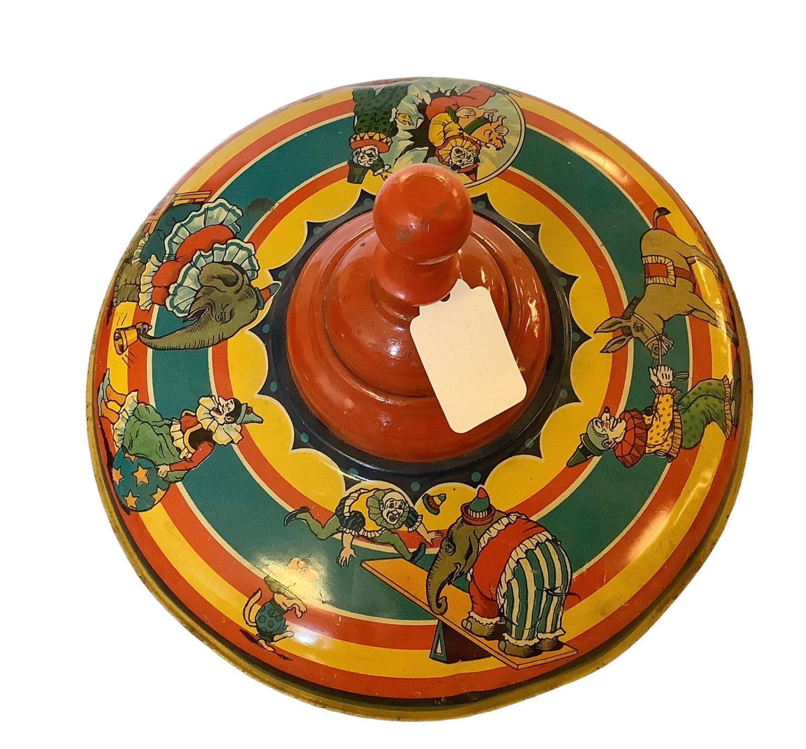 1930’s tin toy top with Circus Motif. 10-inches in diameter. Some flaking and rust on bottom: 1930’s tin toy top with Circus Motif. 10-inches in diameter. Some flaking and rust on bottom as shown in photos.