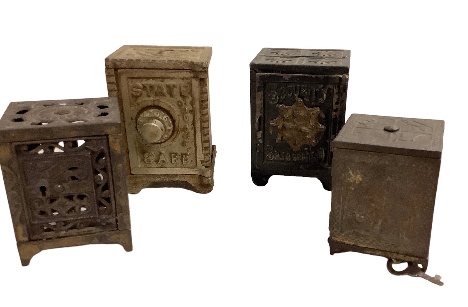 Lot of 4 Antique Cast Iron Still Banks. Four “safes” measuring from 3” to 4” (1 of 1)