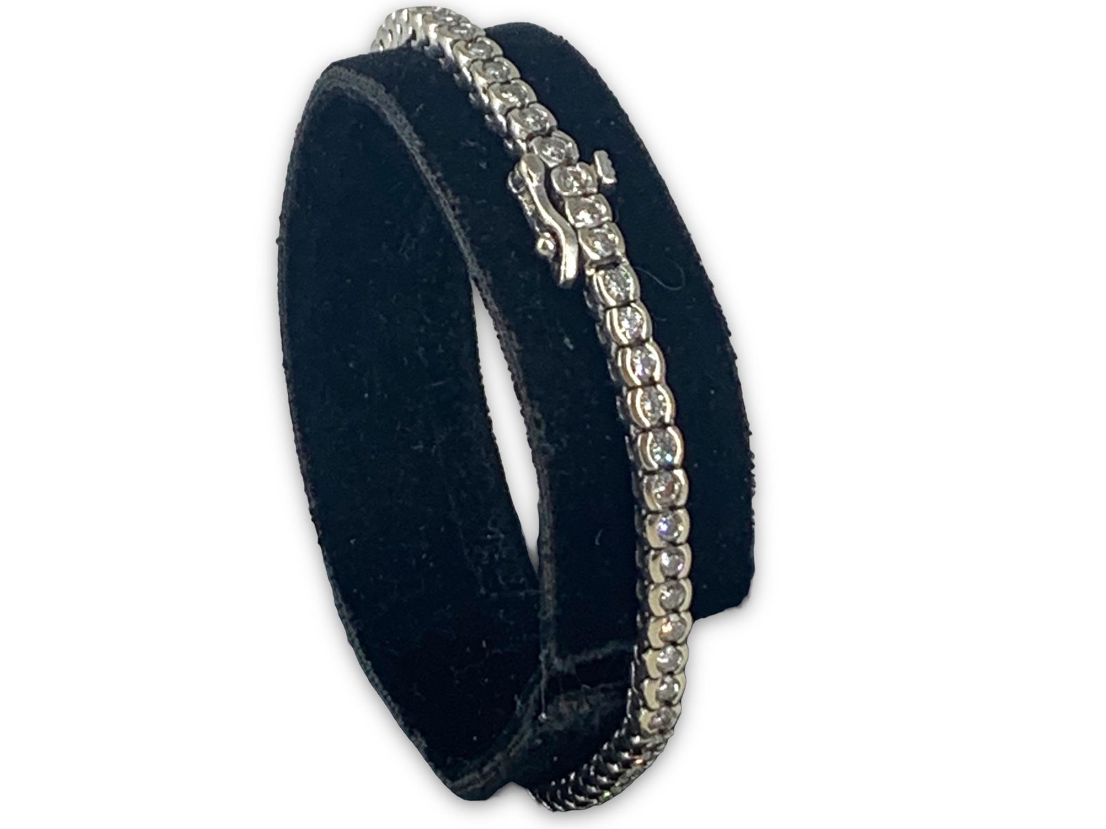 14kt White Gold and Diamond Tennis Bracelet: 14kt White Gold and Diamond Tennis Bracelet Stamped and tested 14kt, 8.7 dwt., 64 diamond rounds @ 2.0mm, diamonds approximately 1.92 cttw, bracelet measures approximately 7.25" in length, slide clasp