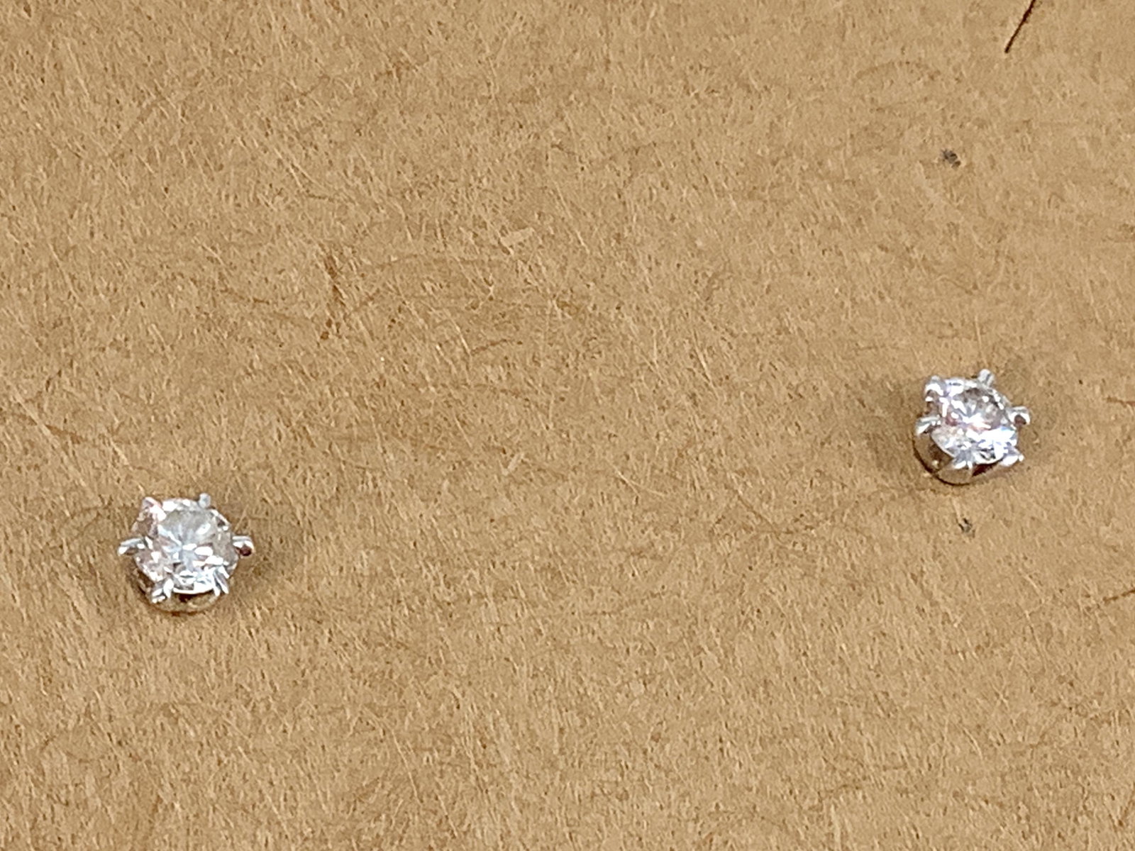 18kt White Gold Diamond Solitaire Earrings: 18kt White Gold Diamond Solitaire Earrings Post screw-back earrings each containing a (2.8mm) brilliant round cut diamond in a six prong setting (approx. 0.16ct tdw) electronically tested (1.5 grams t