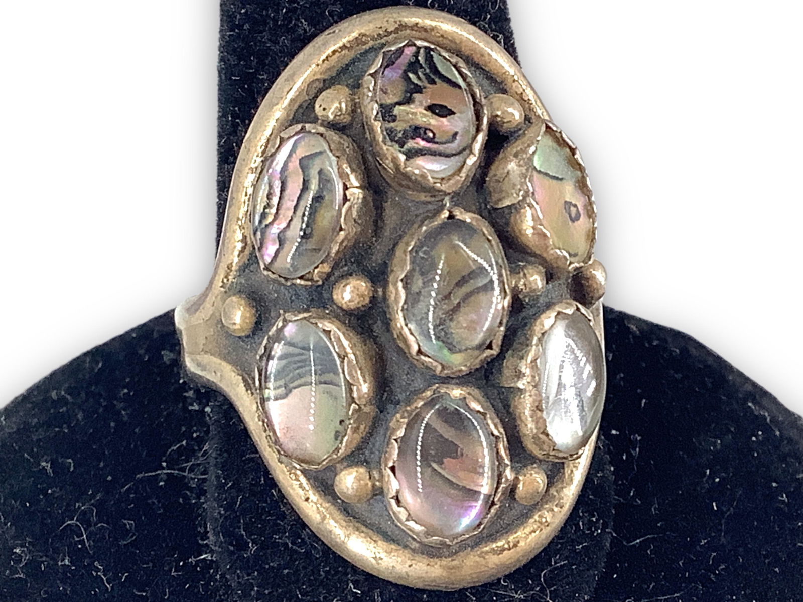 Sterling Silver, Abalone Fashion Ring: Sterling Silver, Abalone Fashion Ring Size (6.25) tapered shank ring with seven abalone stones with resin overlay, stamped and tested (0.17 troy oz tw).