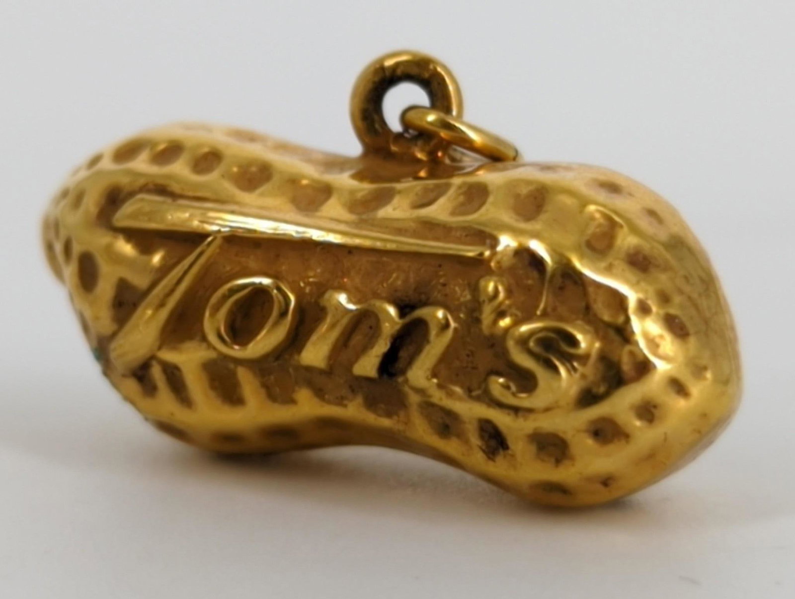 Vintage Gold-Filled "Tom's" Peanut Charm: Vintage Gold-Filled "Tom's" Peanut Charm Stamped and tested, 26.0mm in width, 3.2 grams, branded Tom's Peanuts charm.