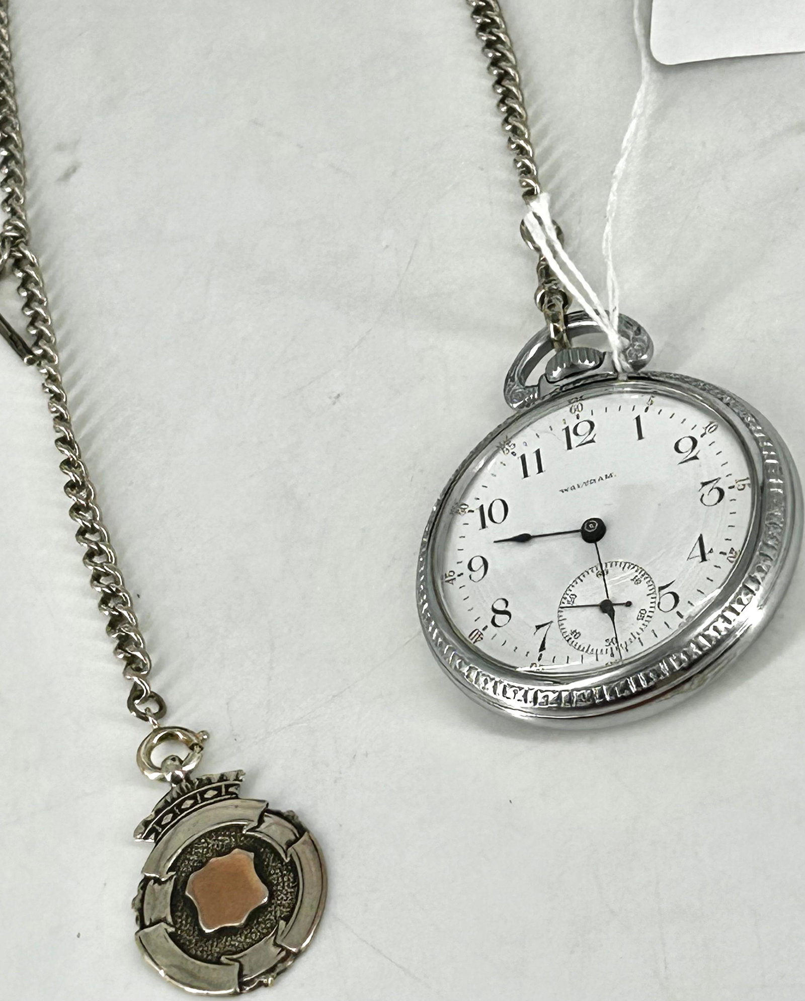 Waltham Pocket Watch on Chain with Fob: Waltham Pocket Watch on Chain with Fob Winds, sets and ticks at time of listing. Movement numbered 11039704, grade 630, model 1899, circa 1901, size 16s, 17 jewels, open face movement configuration, n