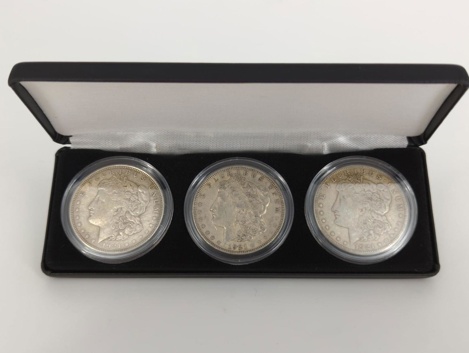 One Box Containing (3) Morgan Silver Dollar Coins (1 of 9)