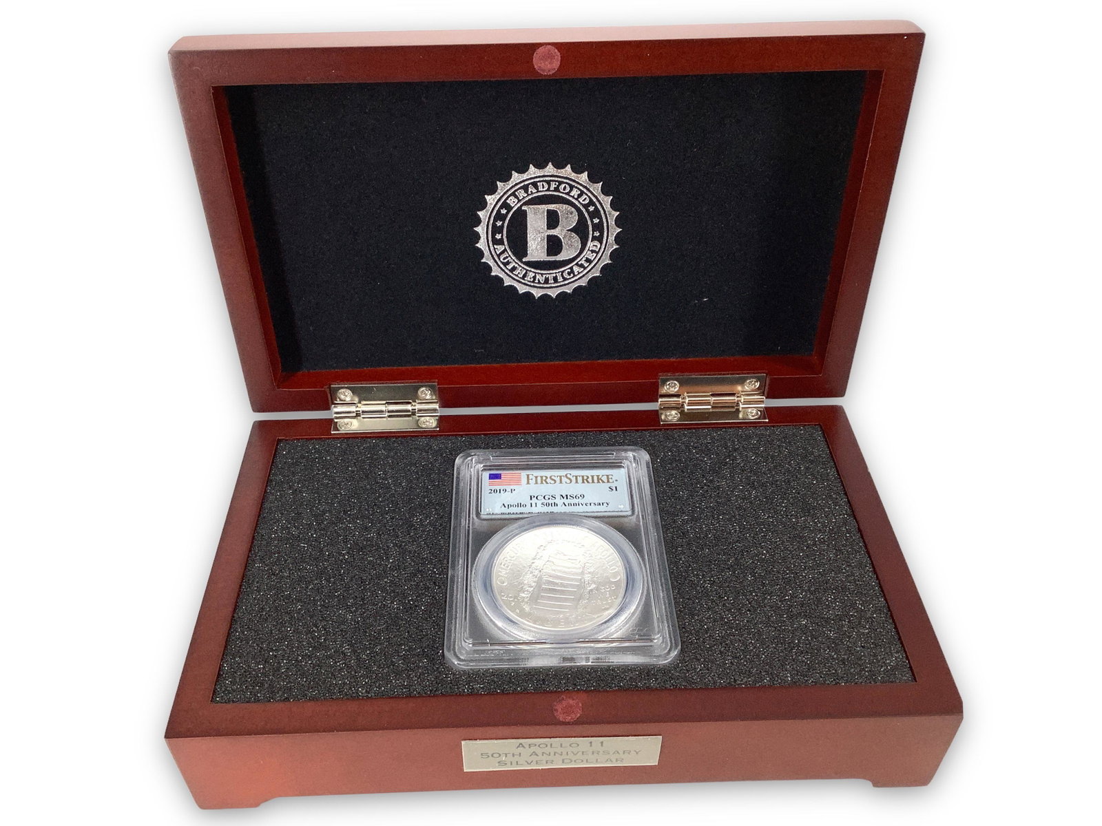 The “First Strike” Apollo 11 50th Anniversary Silver Dollar: The “First Strike” Apollo 11 50th Anniversary Silver Dollar 99.9% silver content, struck in Philadelphia, grade in slab - PR69. One of the coolest collectors coins I have ever seen. The ob