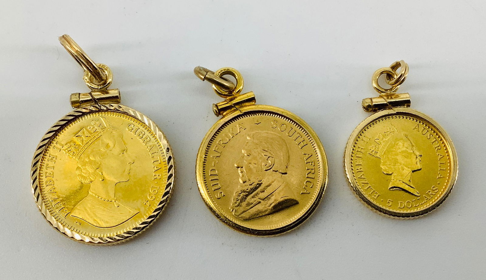 Three Gold Coin Pendants (1 of 2)
