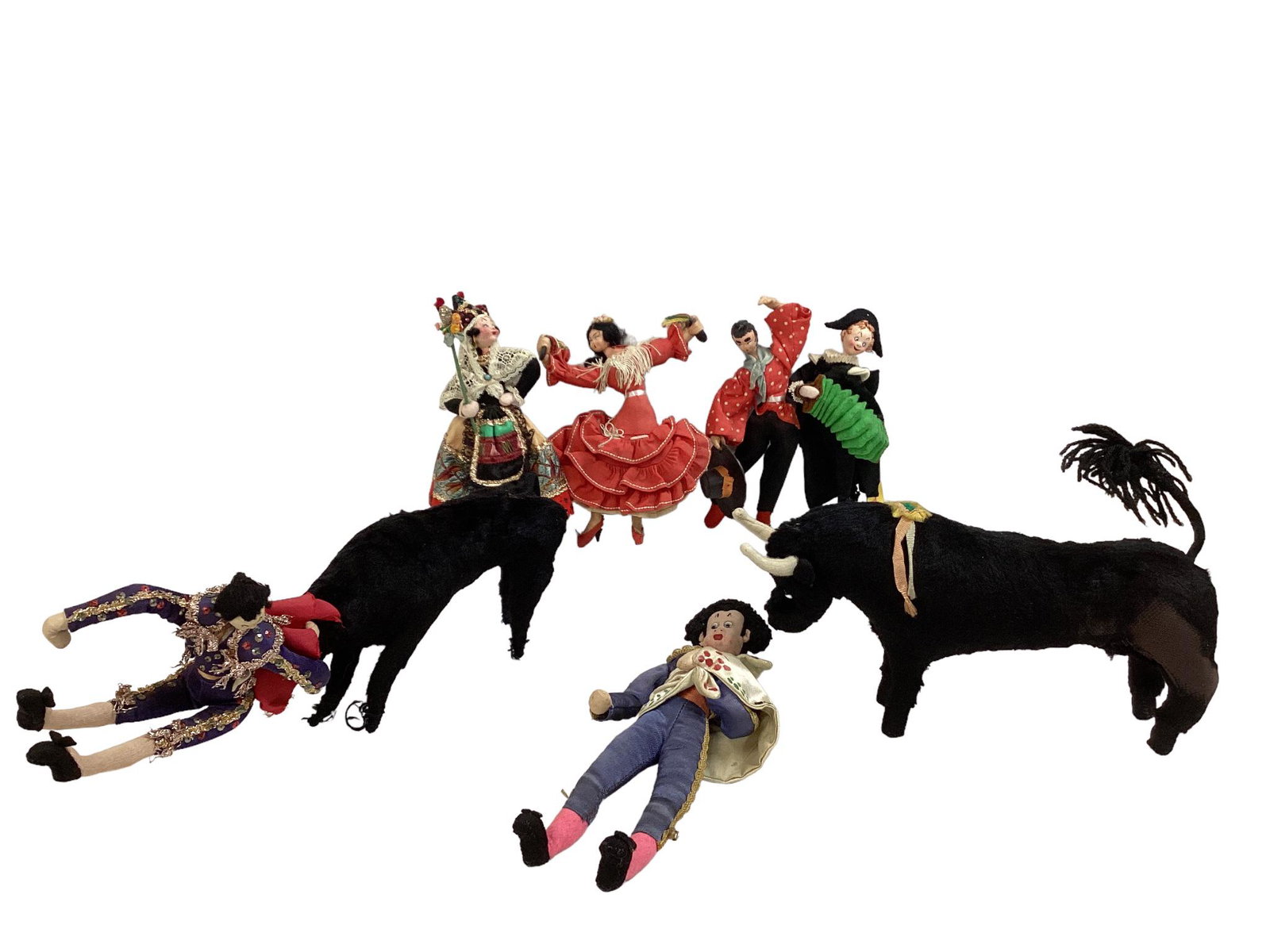 Collection of (7) dolls including Klumpe Matador bull fighting dolls and bulls. One bull's mohair is (1 of 3)