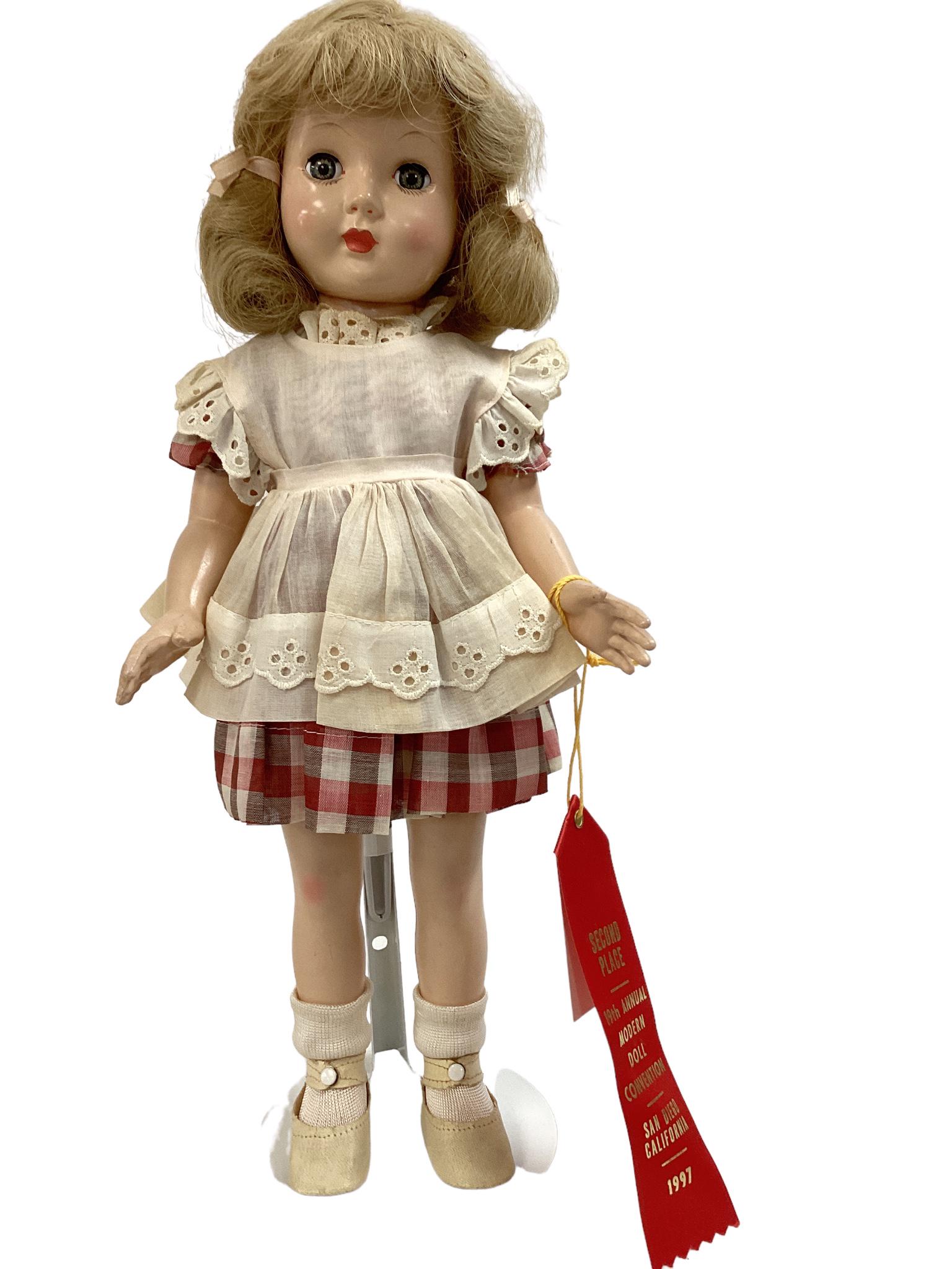 Effanbee hard plastic "Honey". 16" doll with human hair wig, sleep eyes, closed mouth, on five-piece: Effanbee hard plastic "Honey". 16" doll with human hair wig, sleep eyes, closed mouth, on five-piece body. Honey wears her original dress, pinafore, undergarments, shoes and stockings. In overall exce