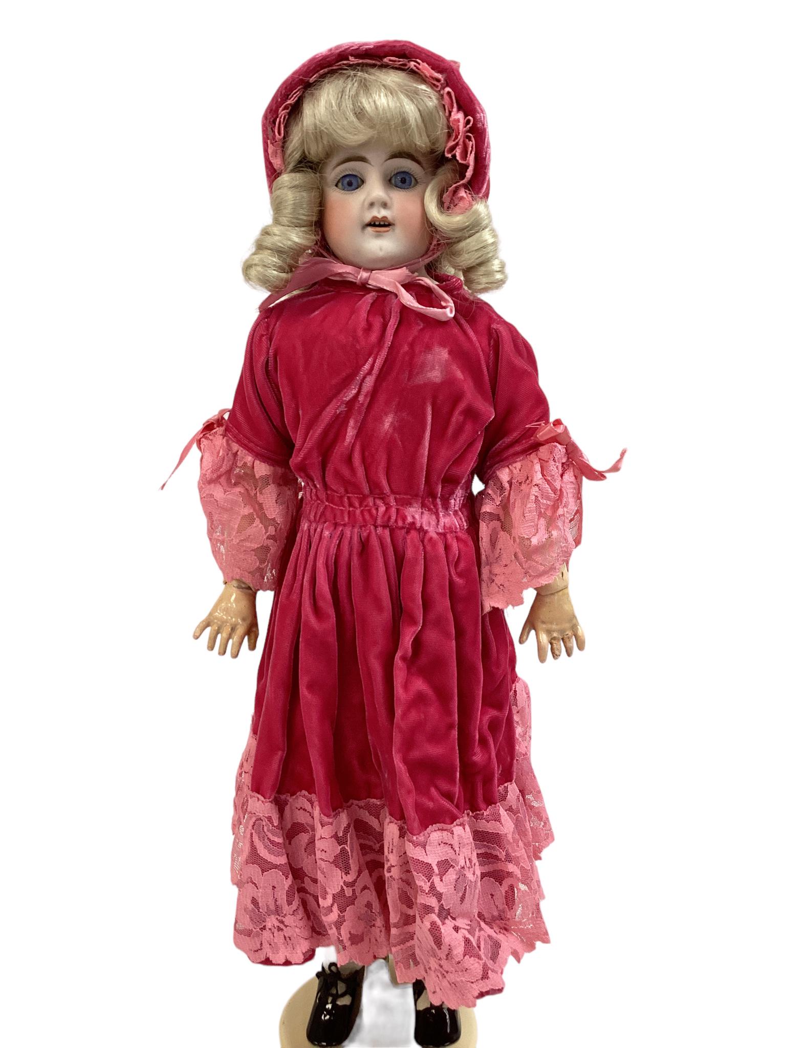 German bisque shoulder head girl marked 309 (likely Bahr & Proschild). 20" doll with replaced wig,: German bisque shoulder head girl marked 309 (likely Bahr & Proschild). 20" doll with replaced wig, glass sleep eyes, open mouth with teeth, on rivet jointed kid body with jointed composition arms. Bis