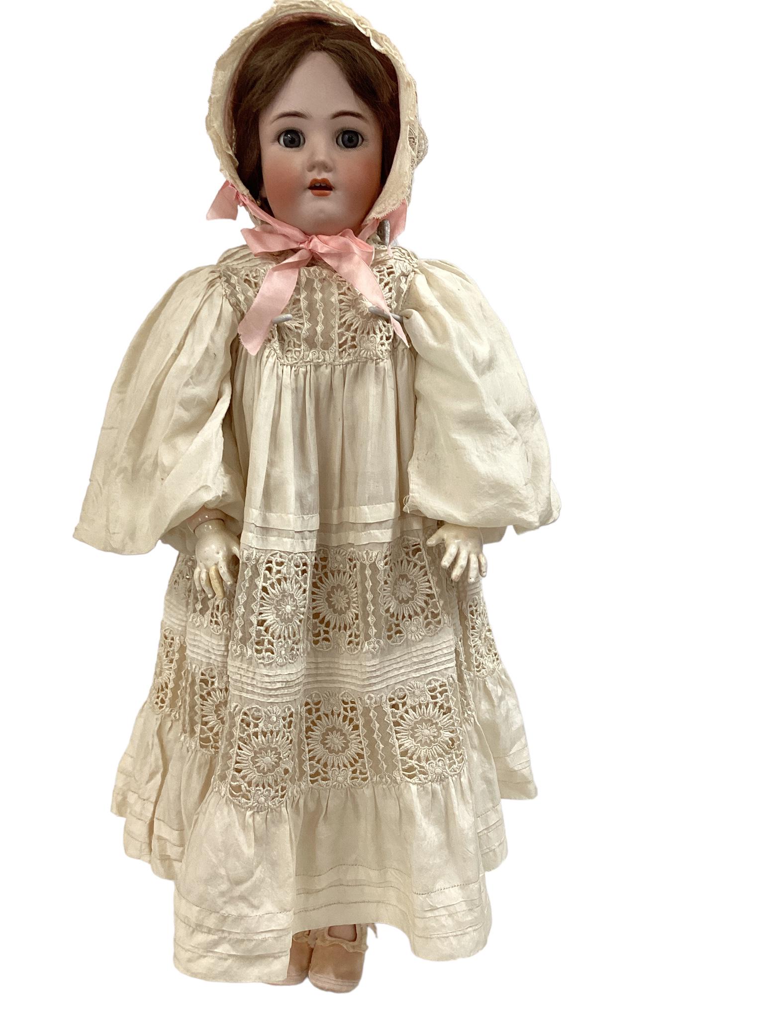 30 3/4" Heinrich Handwerck, Simon & Halbig with mohair wig, sleep eyes, painted eyelashes and facial: 30 3/4" Heinrich Handwerck, Simon & Halbig with mohair wig, sleep eyes, painted eyelashes and facial features, open mouth with teeth. She is wearing a off white (dingy) gown with a matching bonnet and