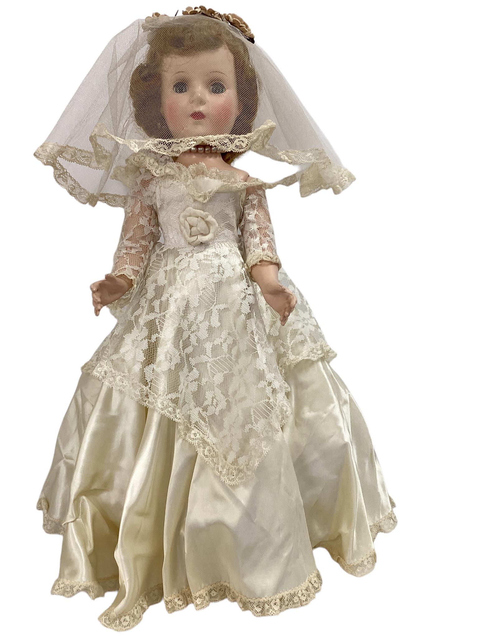 17 3/4" unmarked hard plastic walking Bride doll with mohair wig, sleep eyes. She is wearing a satin (1 of 5)