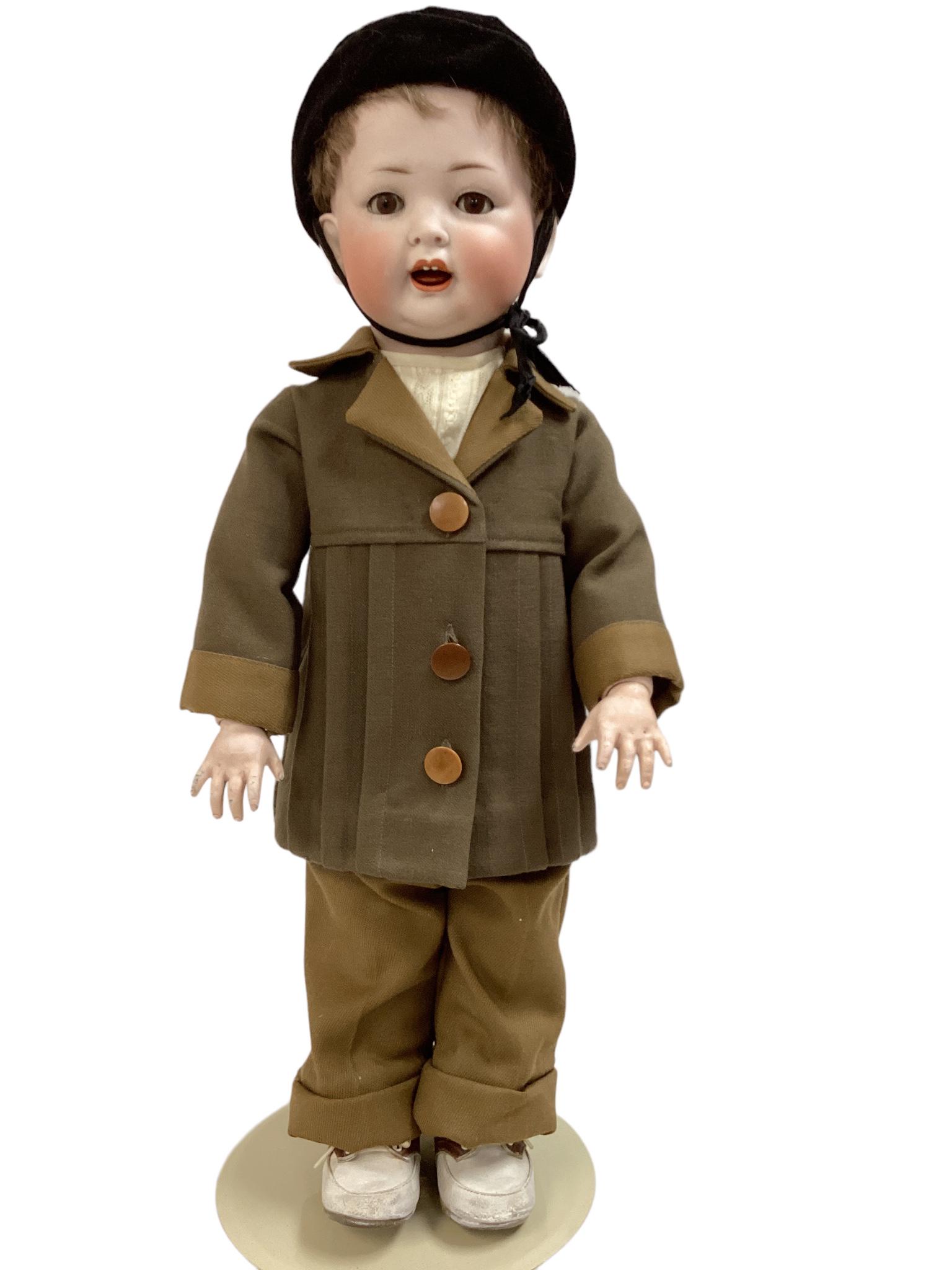Kley & Hahn bisque socket head toddler boy. 23" doll with mohair wig, glass sleep eyes with: Kley & Hahn bisque socket head toddler boy. 23" doll with mohair wig, glass sleep eyes with eyelashes, open/closed mouth with teeth, on jointed composition toddler body. Wig glued on and not removed f