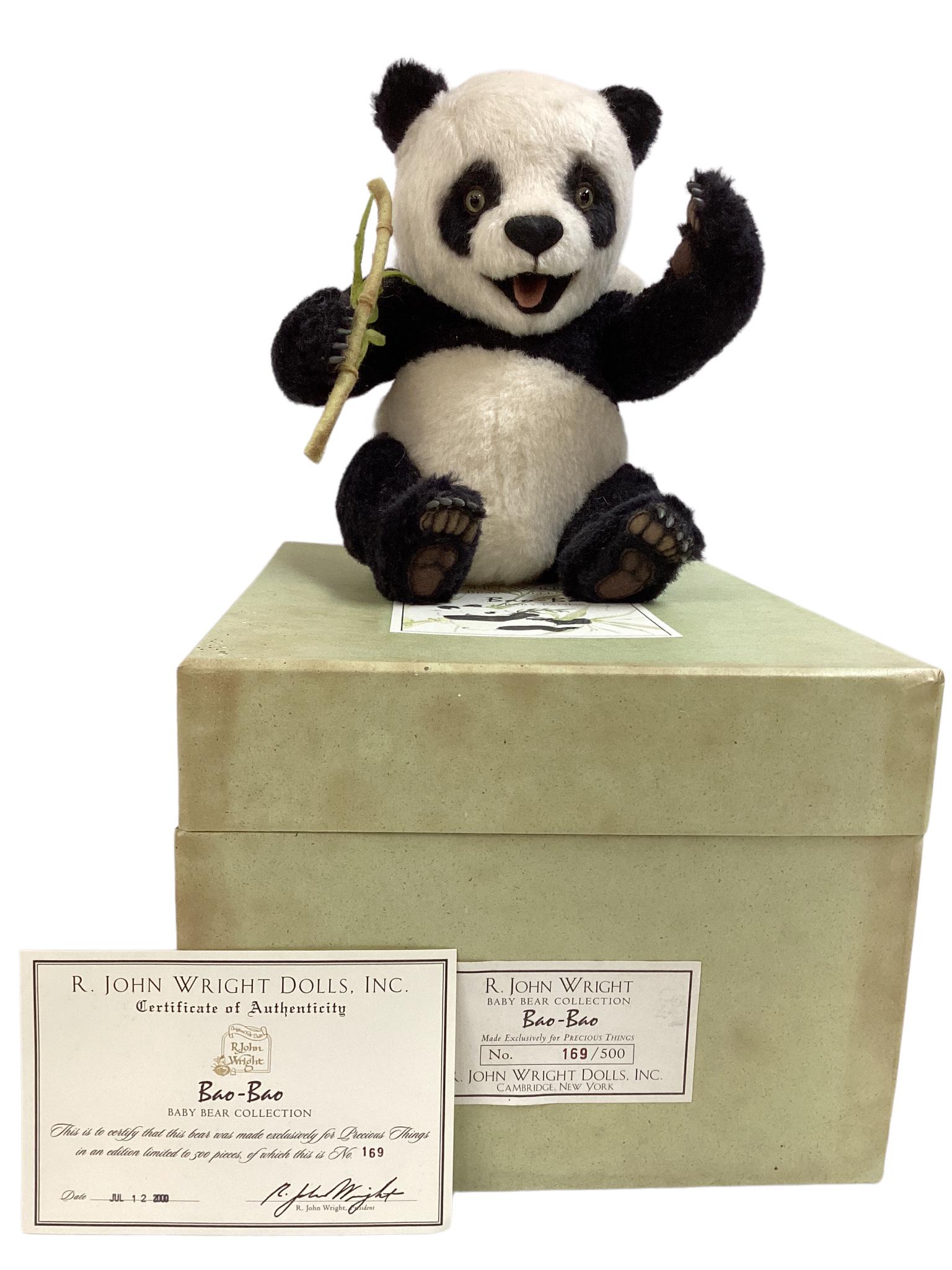 R. John Wright 12" "Bao-Bao" Panda Bear fully jointed, mohair plush with glass eyes, felt nose and: R. John Wright 12" "Bao-Bao" Panda Bear fully jointed, mohair plush with glass eyes, felt nose and paw pads, resin claws and holds felt bamboo. (1999), One of five pieces in the "Baby Bear Collection.