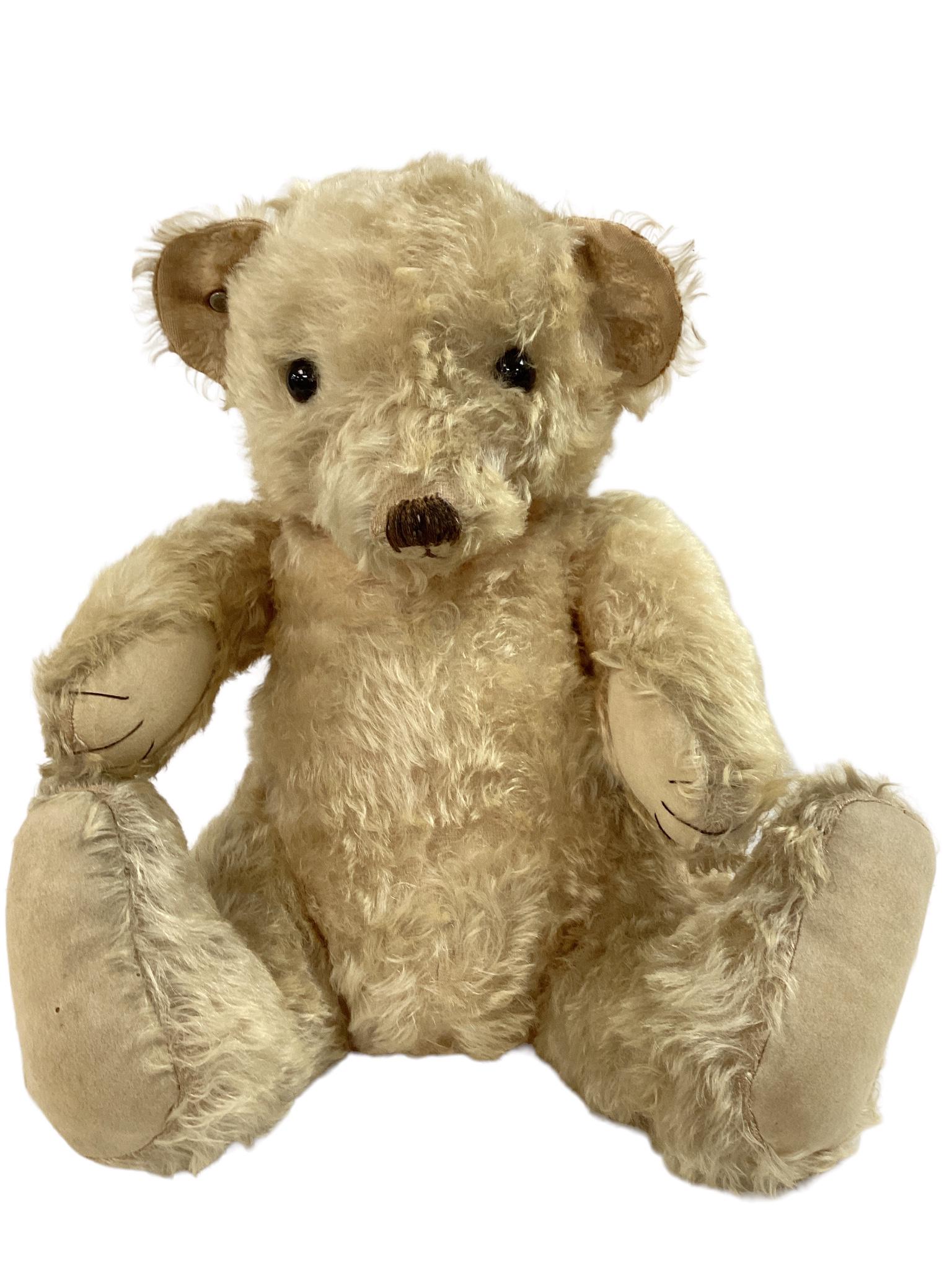 18" Merrythought blonde mohair (thinning) bear, glass eyes, sewn nose, mouth and claws. Does have a (1 of 5)