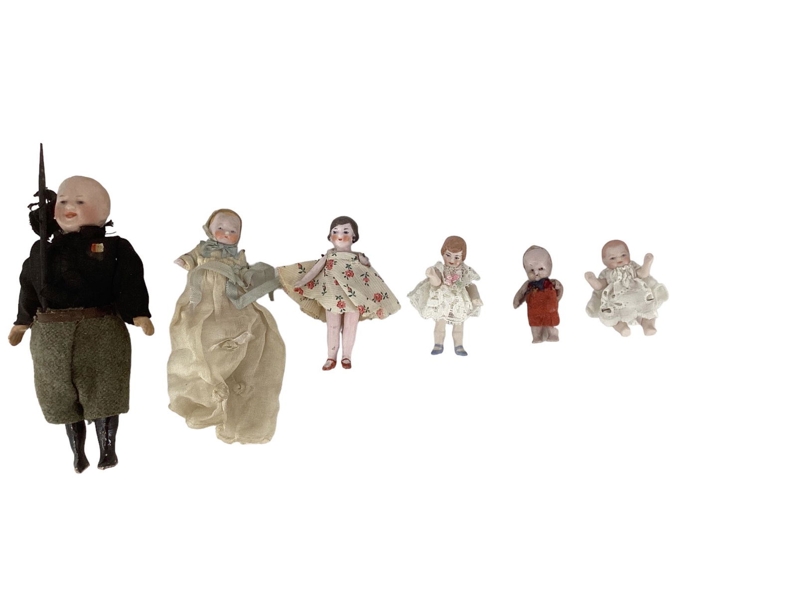 (6) bisque dolls including 6" bisque head soldier doll and 5-bisque doll house dolls ranging in size (1 of 2)