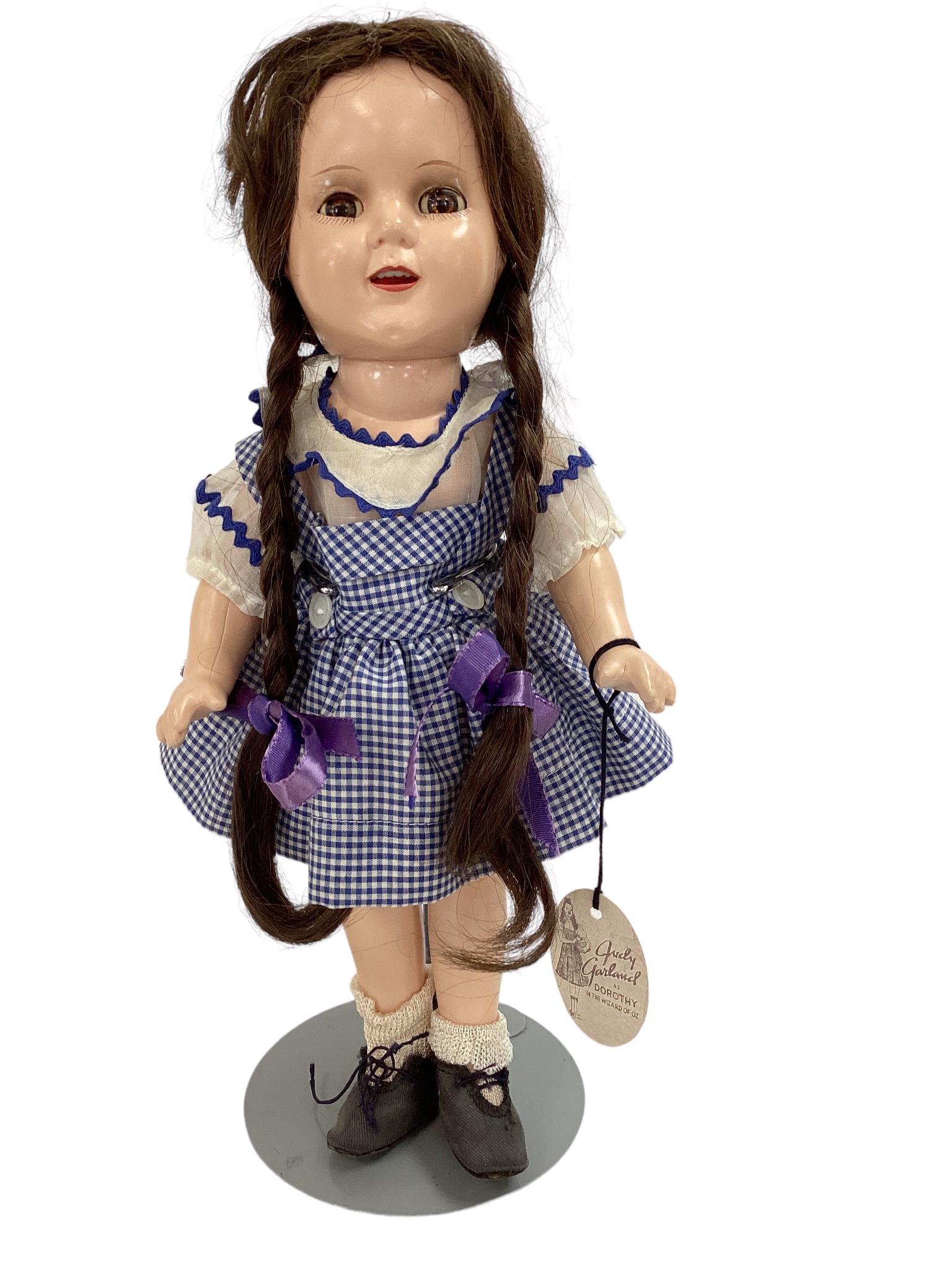 Ideal composition Judy Garland 13" doll with original clothes and paper hanging tag, body is a (1 of 3)