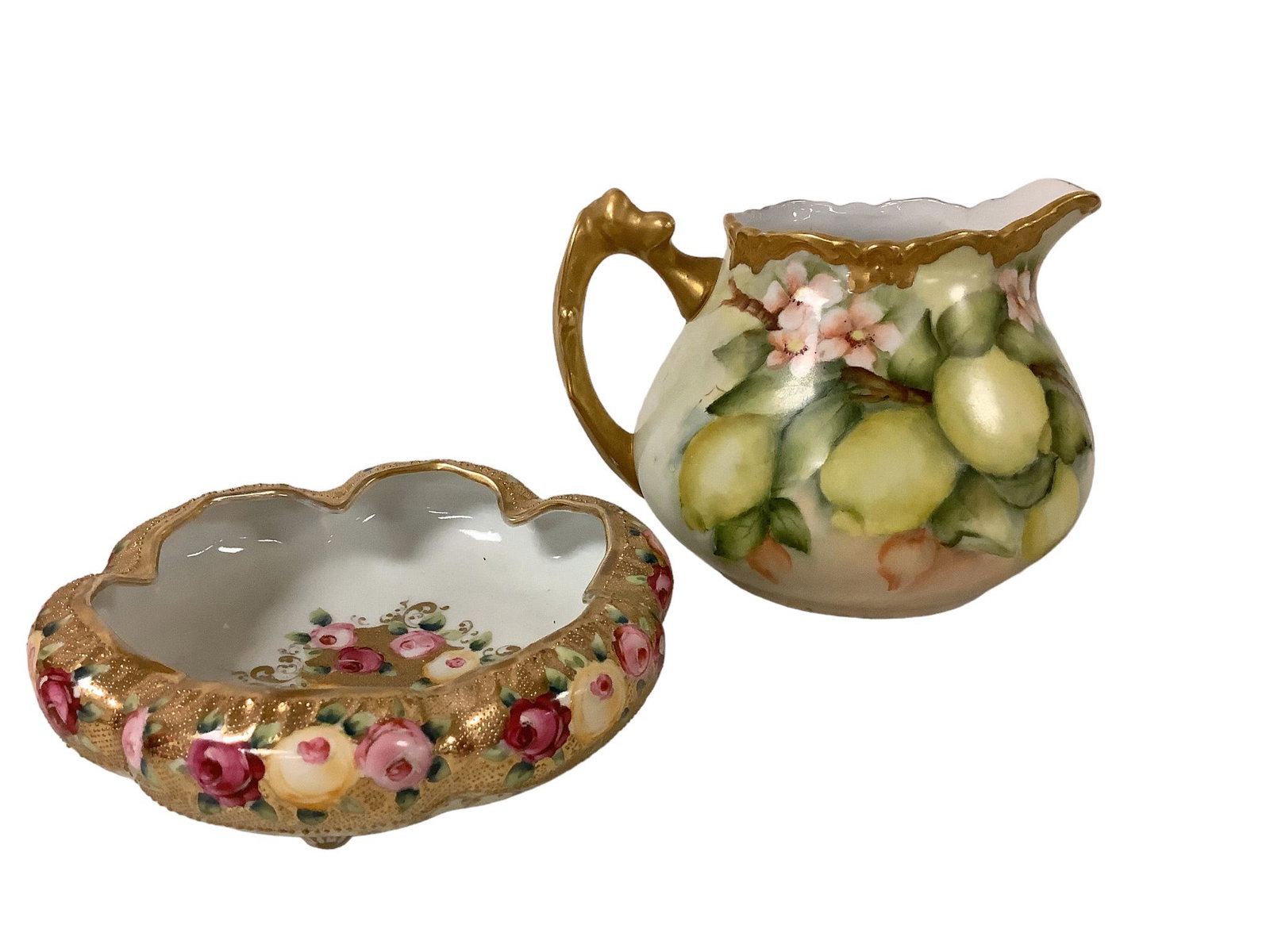 Pitcher and Lovely Nippon Bowl: A hand-painted pitcher featuring fruit and blossoms @ 6î tall & 9î wide signed by Molly Fenakel and a Royal Kieran footed piece of Nippon with a gold and rose motif @ 7î wide.