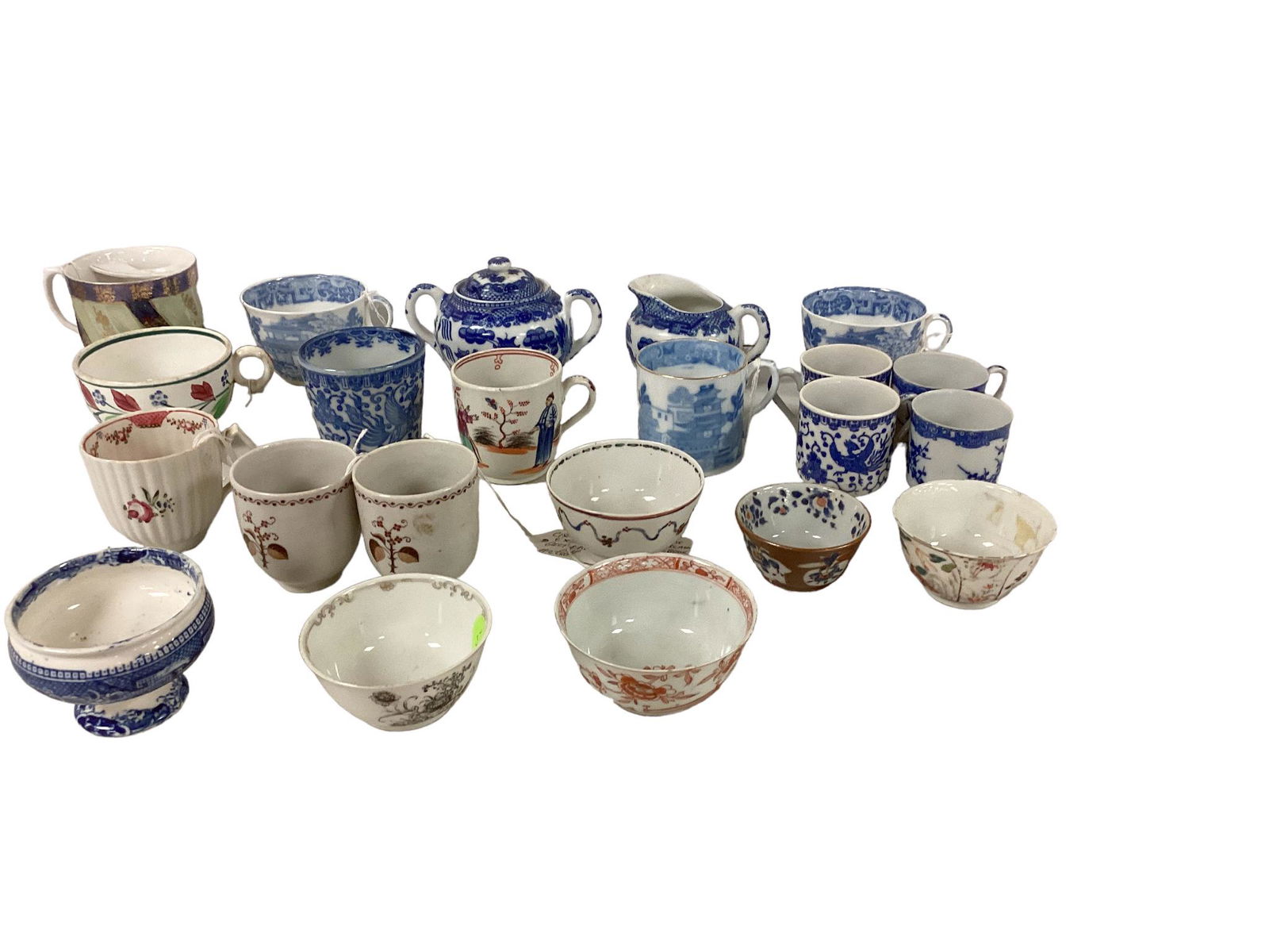 Assorted China: (22) items including tea cups, cream & sugar and some cups w/o handlesShipping Note: $80.00 packing and materials fee plus actual carrier costs.