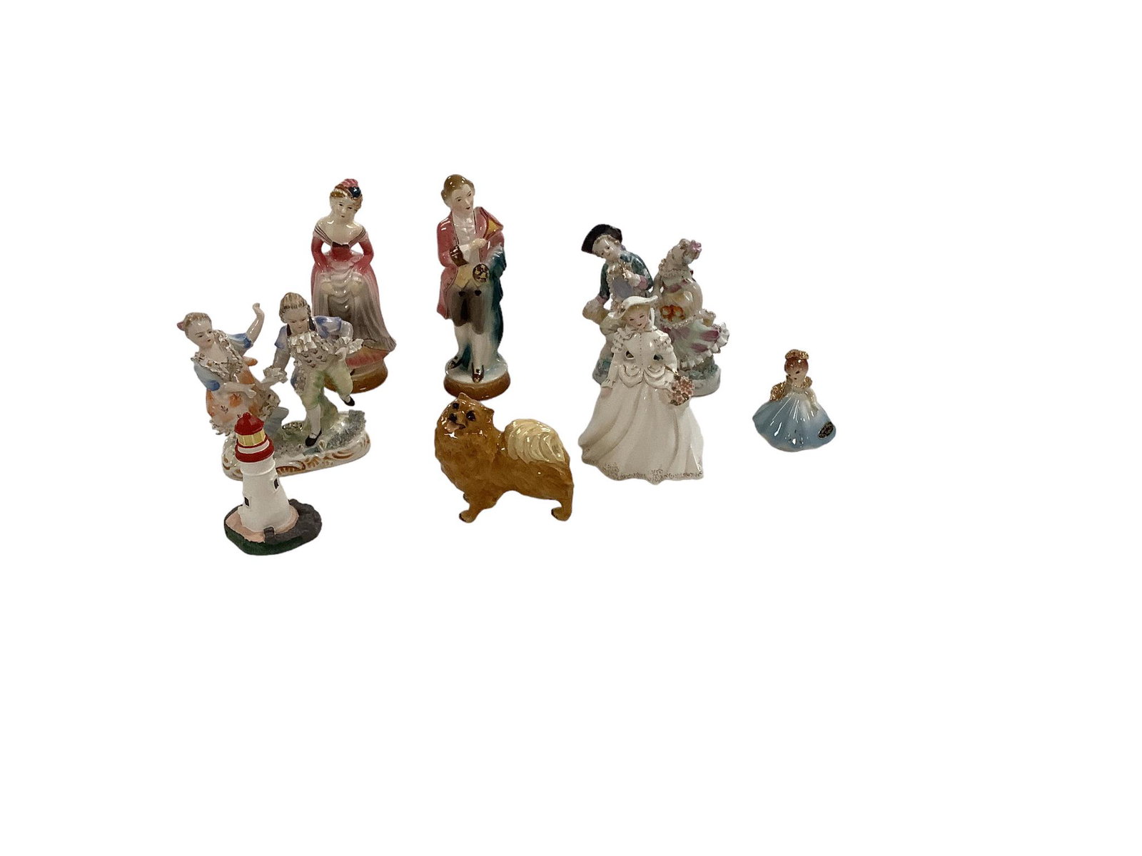 Ceramic Figurines: Variety of (8) figures. France Geramiss. Pair of Bone Lina, Spooliques lighthouse.Moryama Occupied Japan, colonial figurines.