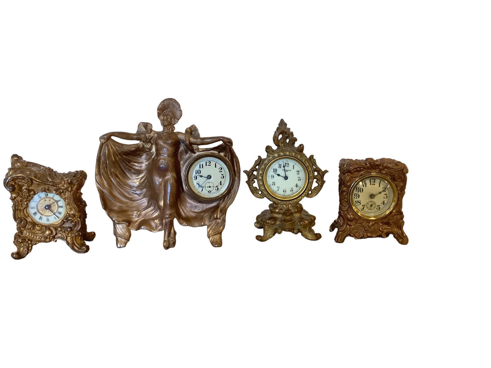 (4) Metal Mantel Clocks: (4) Metal Mantel Clocks (1) is made by the Rochelle Clock Mfg. Co., 6.5îL x 7îH, (1) is New Haven, 4îL x 6îH, the others are unmarked, 2.75îL x 4îH.