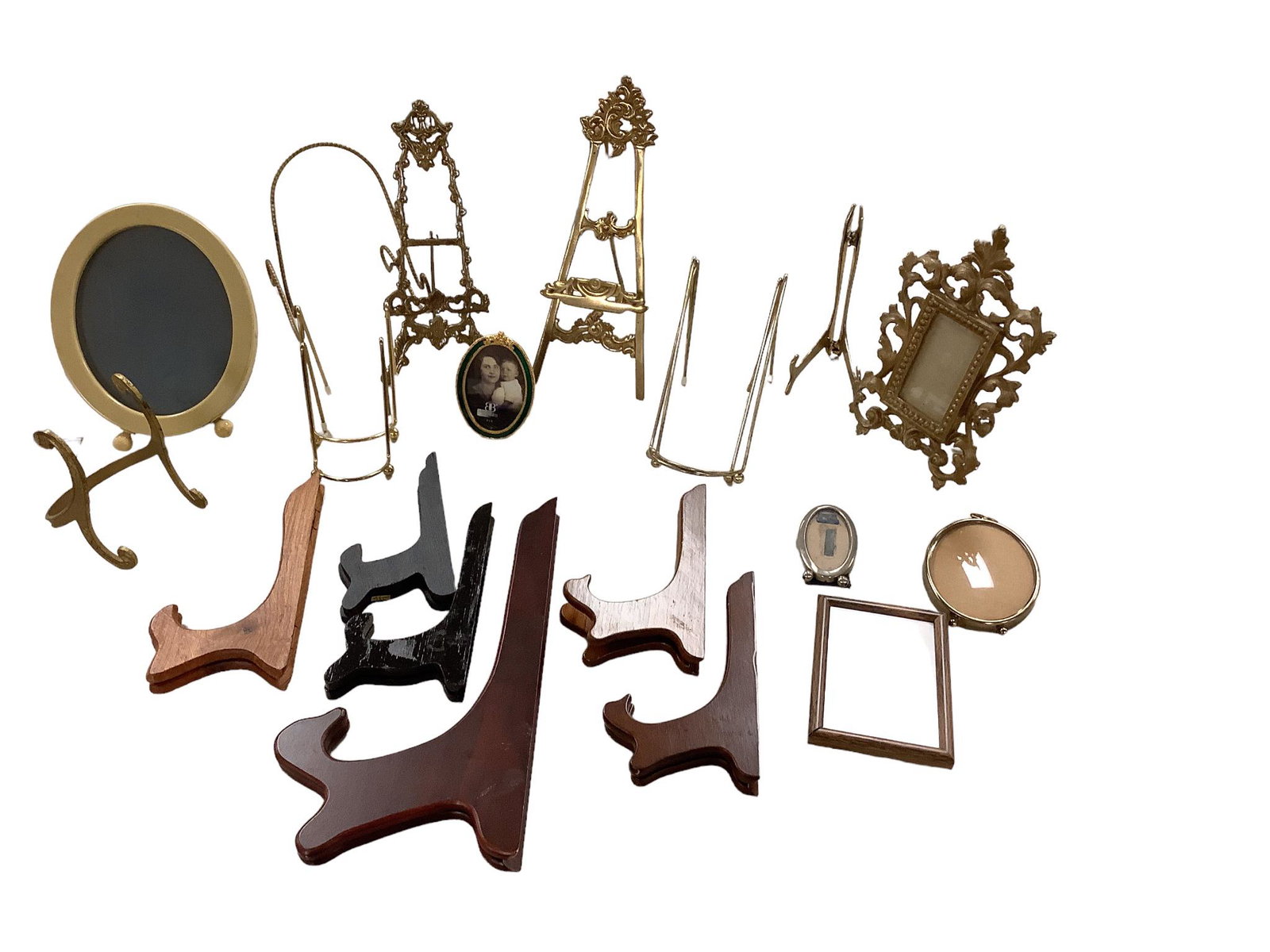 Picture and Plate Easels: Picture and Plate Easels A total of 21 metal and wood picture and plate stands and frames. Tallest stand is wood and measures 12î H. - smallest is brass tone and measures 4î. Group also incl