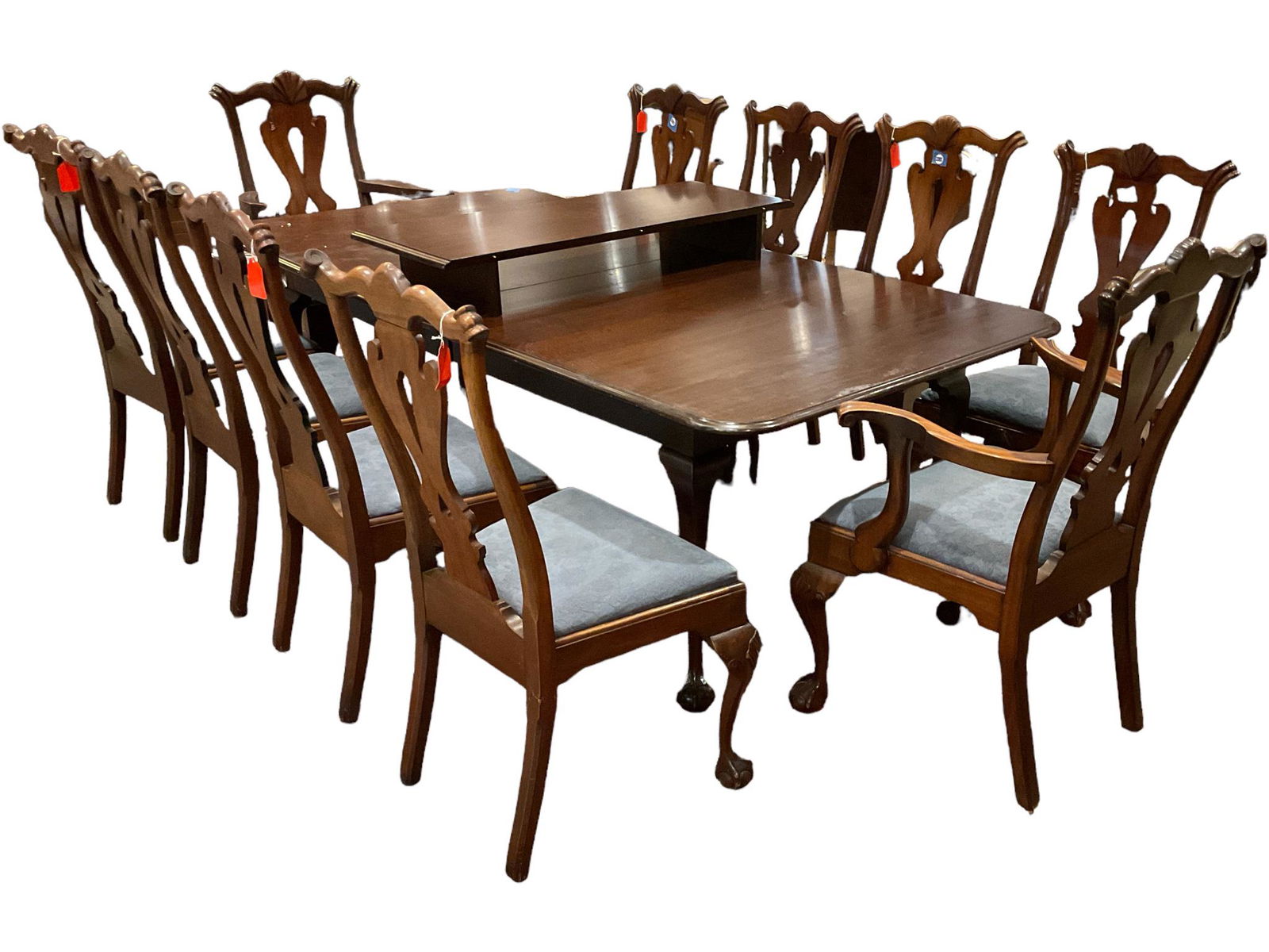 Chippendale Dining Room Set: Chippendale Dining Room Set Mahogany extension table. 44î x 88î x 29î. Three Captains chairs and (9) side chairs. Leg has been repaired on chair.