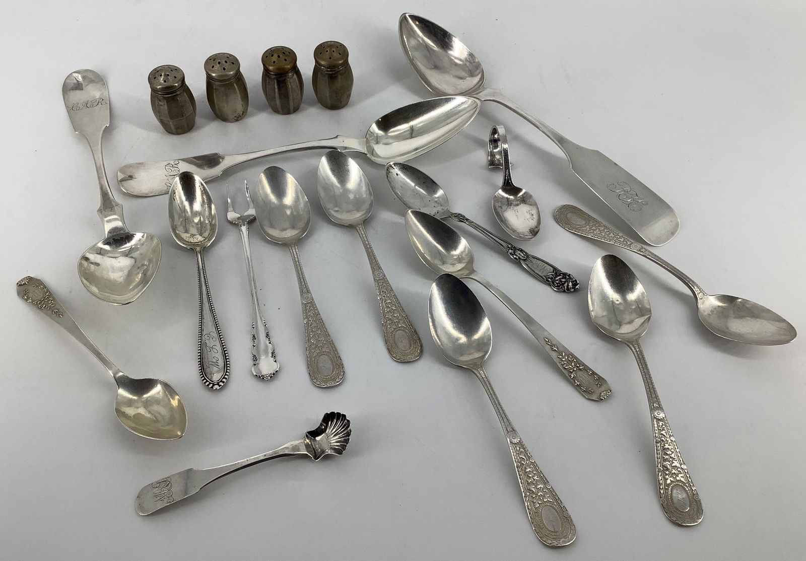 Silver and Silver Plate Flatware and Serveware: Silver and Silver Plate Flatware and Serveware Nine sterling silver spoons + sterling silver pickle fork - 6.265 troy ounces total weight. Four silver plate salt and pepper shakers, two silver plated
