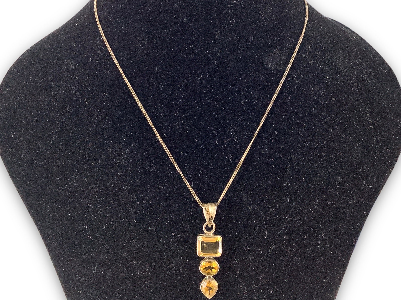 Sterling Silver Necklace with Citrine Stones in Slide Pendant: Sterling Silver Necklace with Citrine Stones in Slide Pendant Stamped and tested 925/sterling silver, 7.1 grams total weight, 15.5" choker length, graduated size stones in several cuts measuring up to