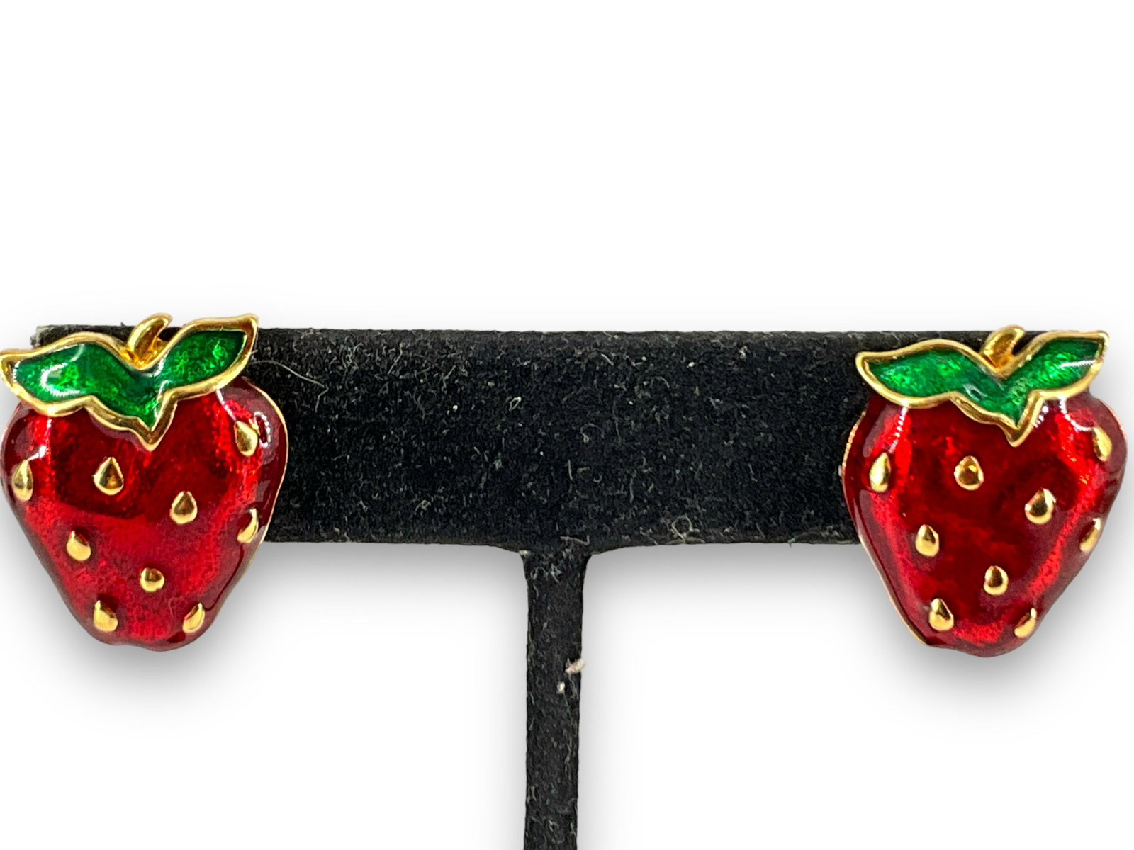 Adorable Enameled Strawberry Earrings: Adorable Enameled Strawberry Earrings Post back earrings measuring (0.82”) in length, gold tone base medal with vibrant cherry red and emerald green enamel inlay, unsigned piece.