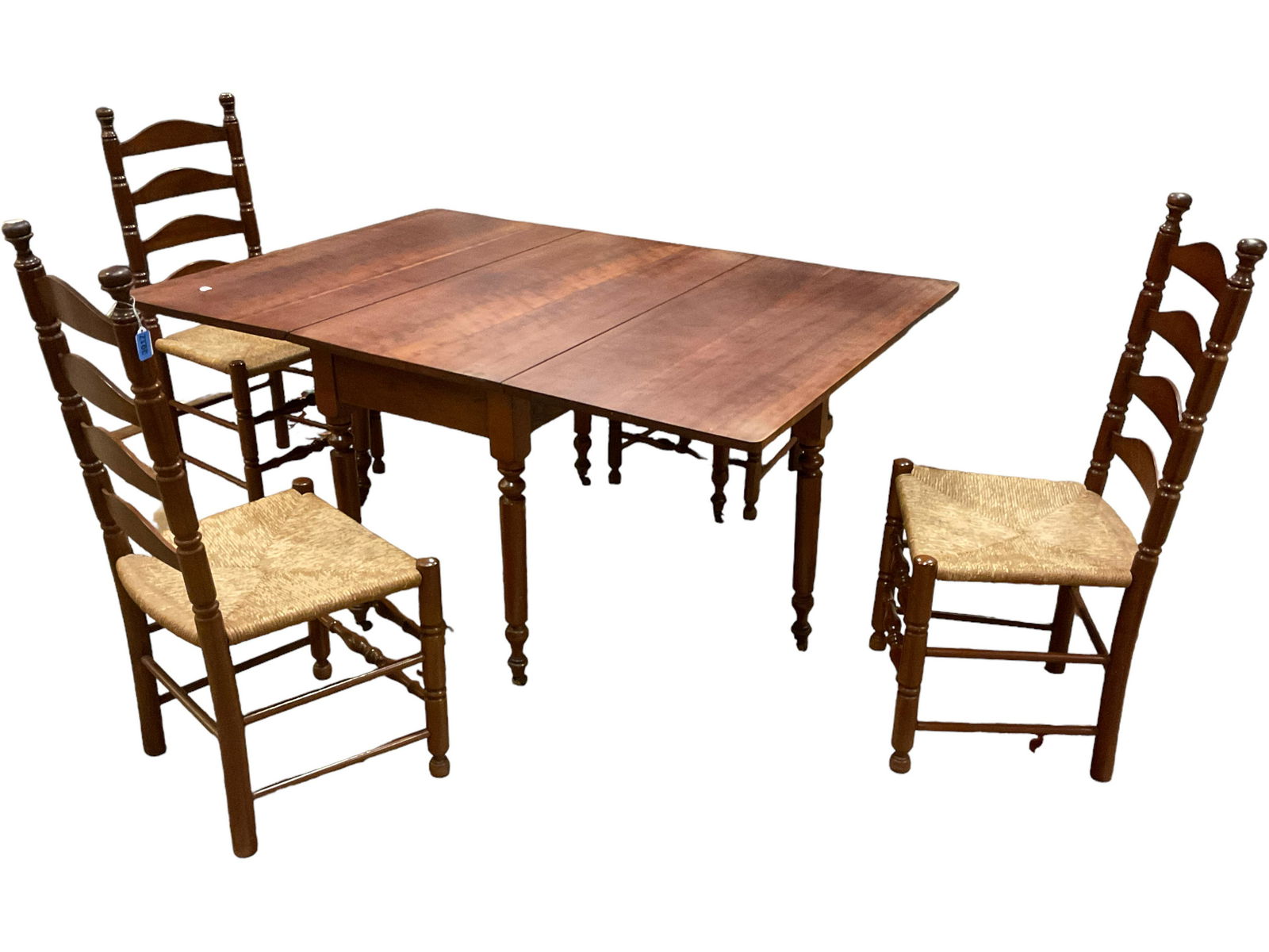 Dining Room Table & Four Chairs: Dining Room Table & Four Chairs Table is a cherry six leg Sheraton drop leaf, 62î x 45î x 28.5î (open fully). Chairs are ladder backs with rush seats, 41î tall.