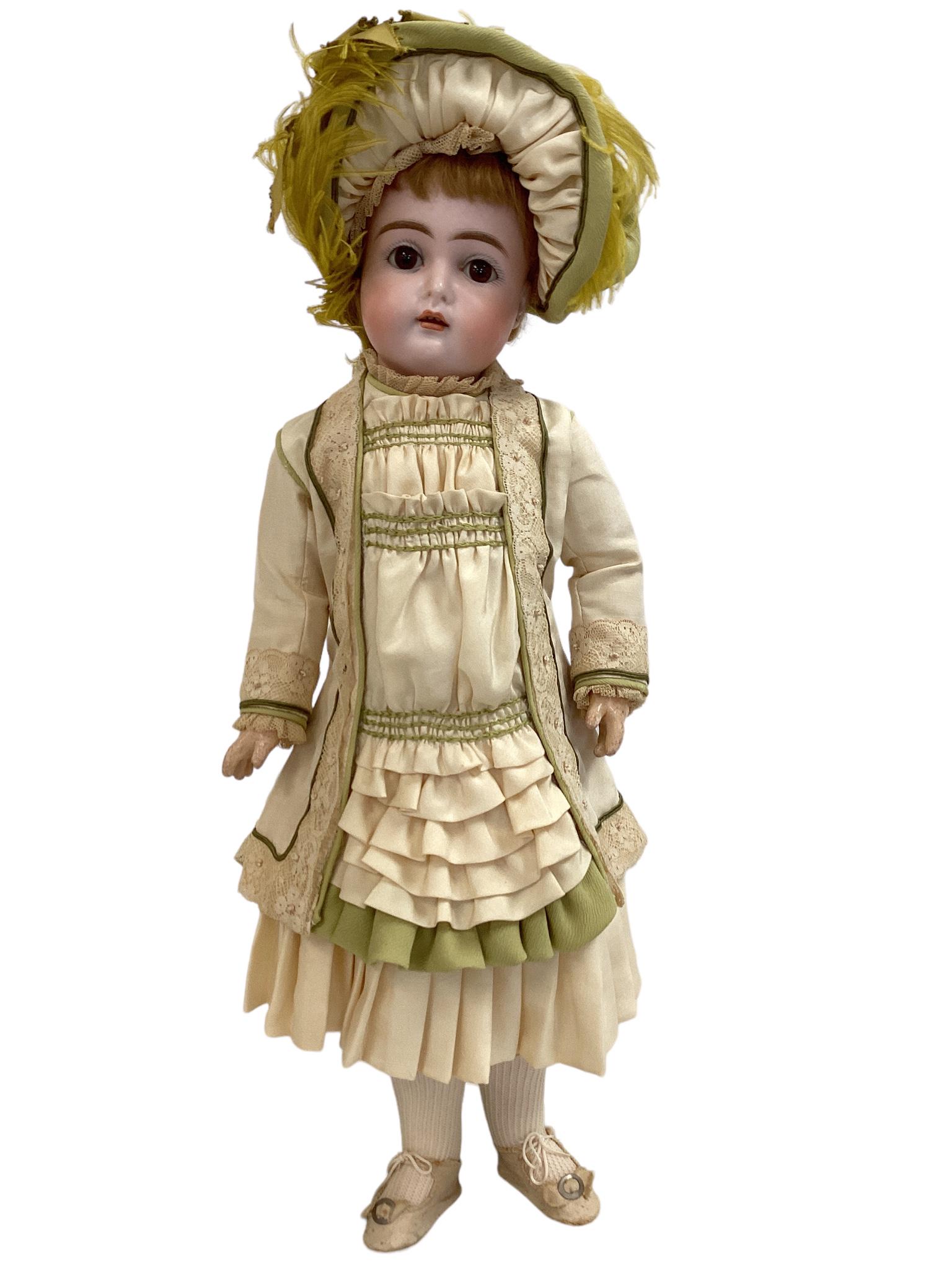 Kammer & Reinhardt 192 Bisque Socket Head Girl: Kammer & Reinhardt 192 Bisque Socket Head Girl 18" doll with original mohair wig, glass eyes, pierced ears, open mouth with teeth, on jointed composition body. Doll is nicely redressed in Parisian sty