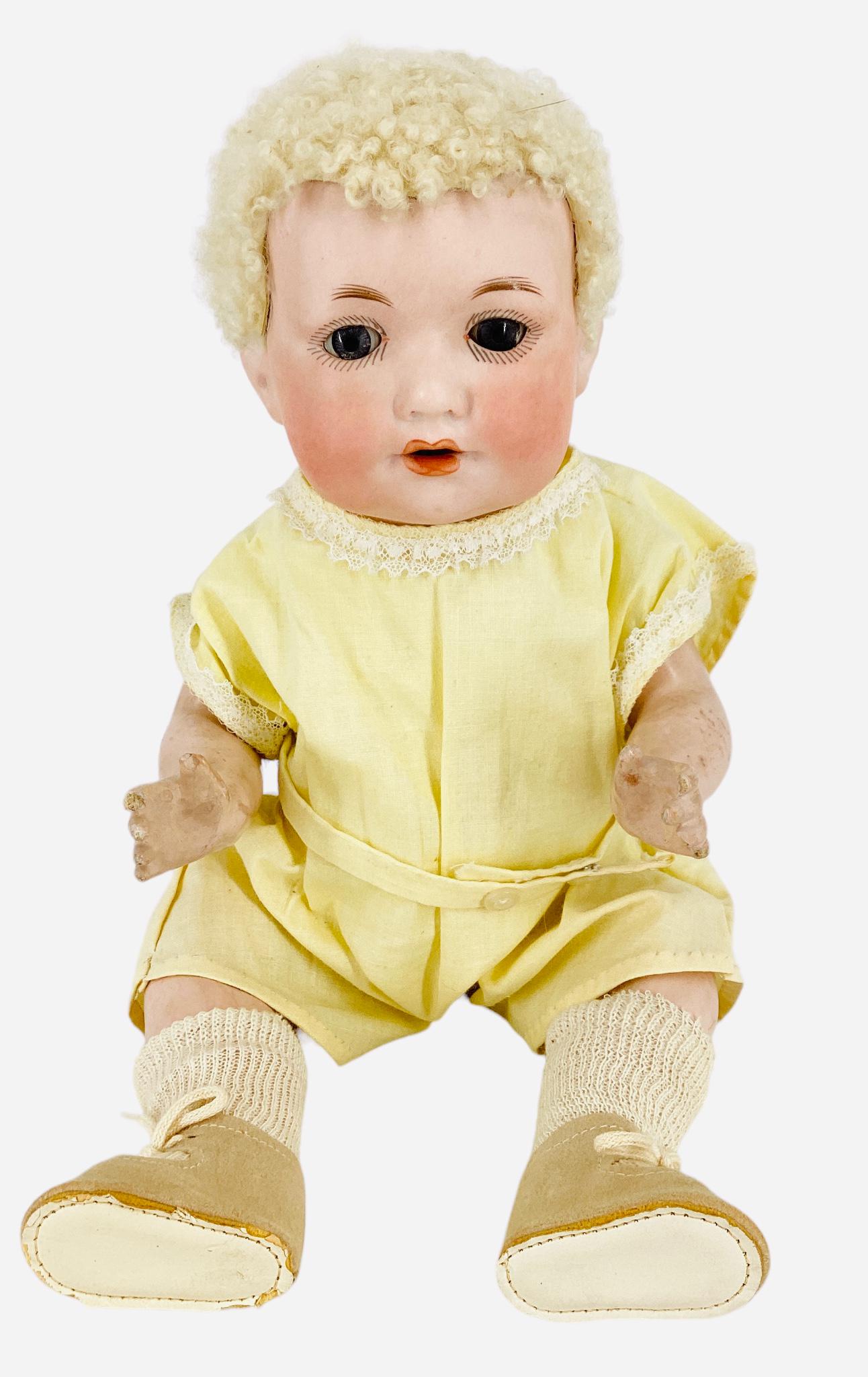 Armand Marseille "A3M" Bisque Socket Head Character Baby: Armand Marseille "A3M" Bisque Socket Head Character Baby 13" doll with blonde caracul wig, glass sleep eyes, open mouth with teeth, on five-piece composition bent limb baby body. Wig glued on and not
