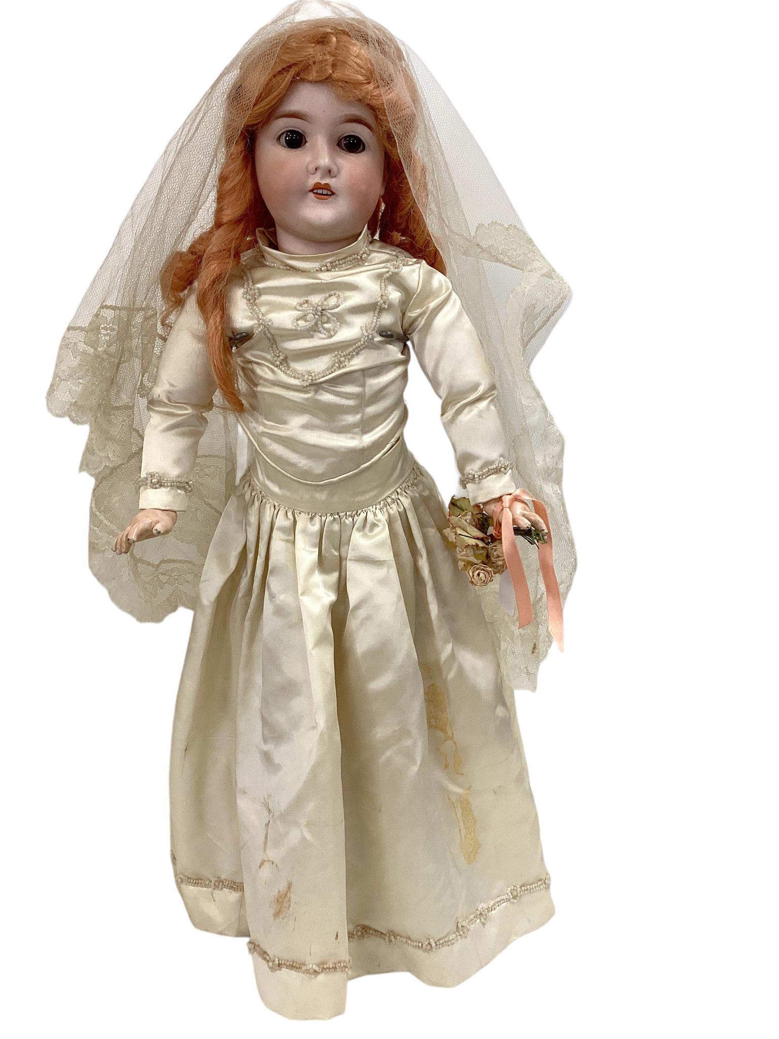 Queen Louise Bisque Socket Head Bride: Queen Louise Bisque Socket Head Bride 24" doll with synthetic wig, glass sleep eyes have been set, open mouth with teeth, on jointed composition body. Dressed in antique ivory satin gown, undergarment