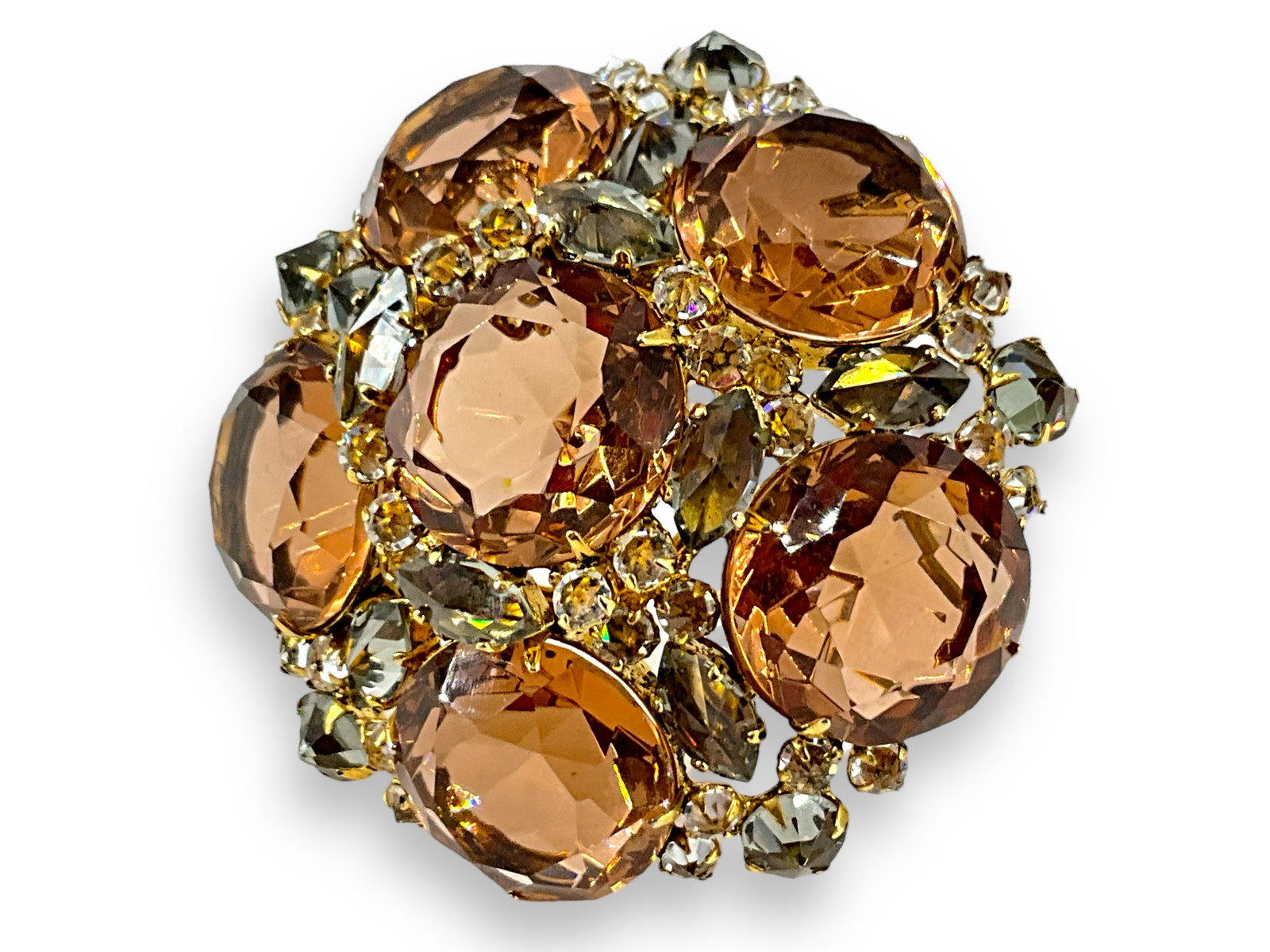 Peach Color Schreiner Brooch: Peach Color Schreiner Brooch Featuring 6 peachy colored transparent round stones with yellow and gray crystal accents, this brooch is signed ìSchreiner New Yorkî and has a 2î width. The