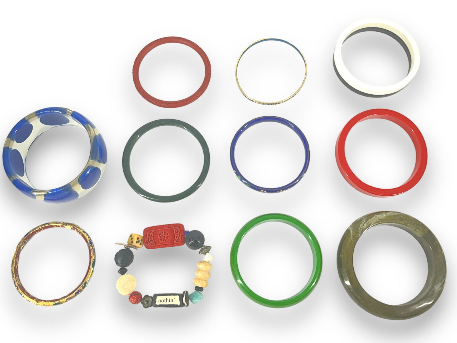 Loads of Bangle Bracelets: Loads of Bangle Bracelets For all your outfits, these 11 bangles are ready made in plastic, metal and wood. Several have a cinnabar look, one is hinged and has a cloisonnÈ appearance, one is stre