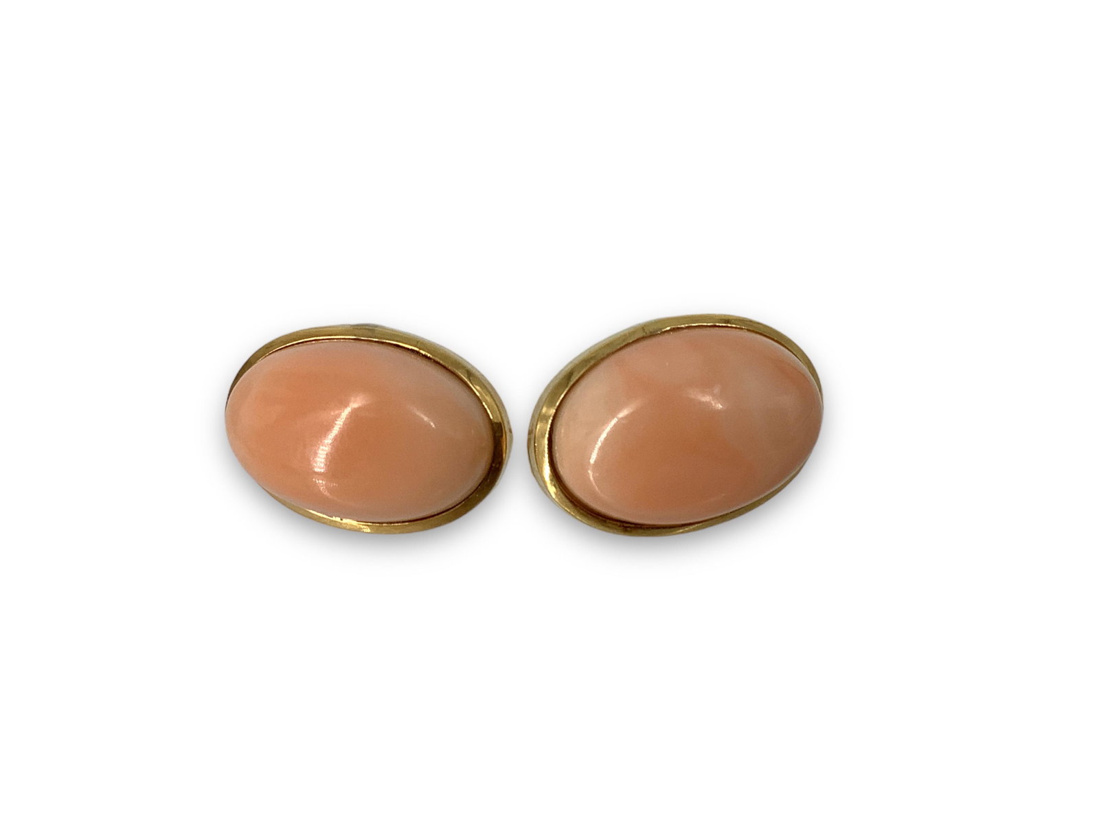 18kt Gold and Coral Earrings: 18kt Gold and Coral Earrings Stamped and tested 750/18kt yellow gold, pierced style on posts with levers, 8.8 grams total weight, 18.75mm in length, with oval shape coral cabochons at center(s) in bez