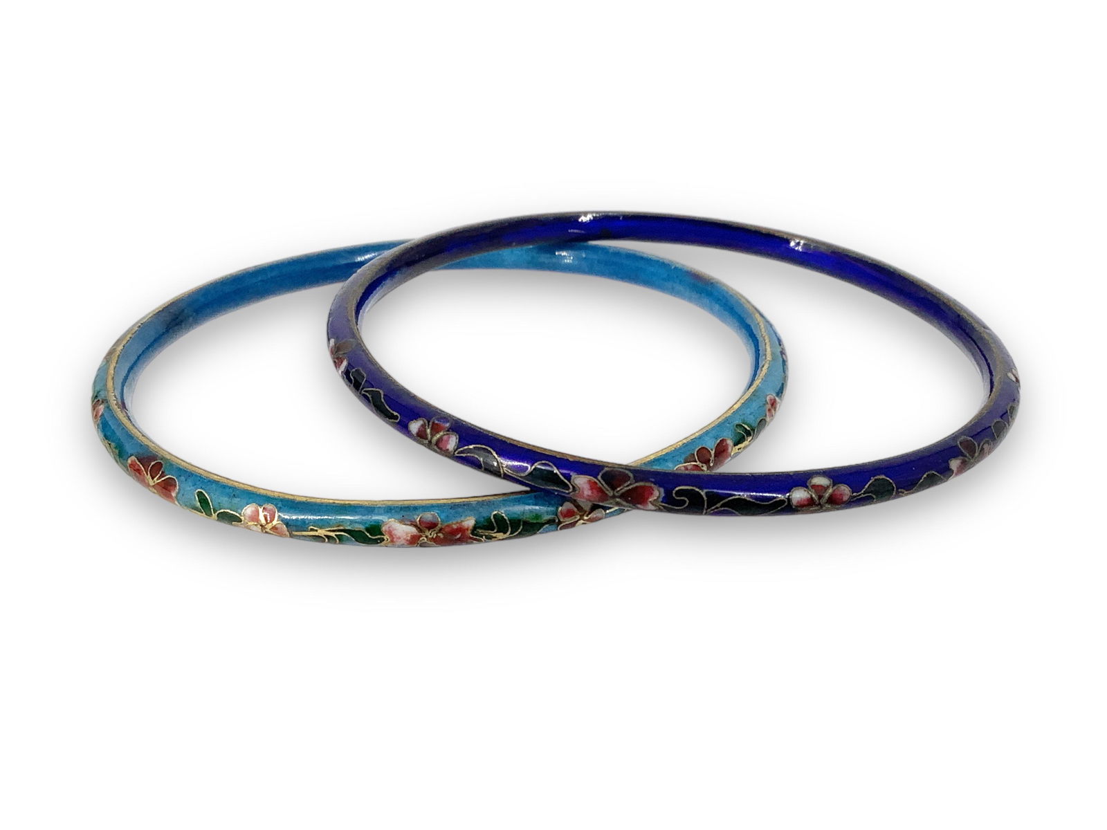 Two CloisonnÈ Bangles: Two CloisonnÈ Bangles Each feature an inner diameter of approx. (2.53î) and measuring (4mm - 4.3mm wide) both bangles feature a floral design, one with a baby blue background and the other n