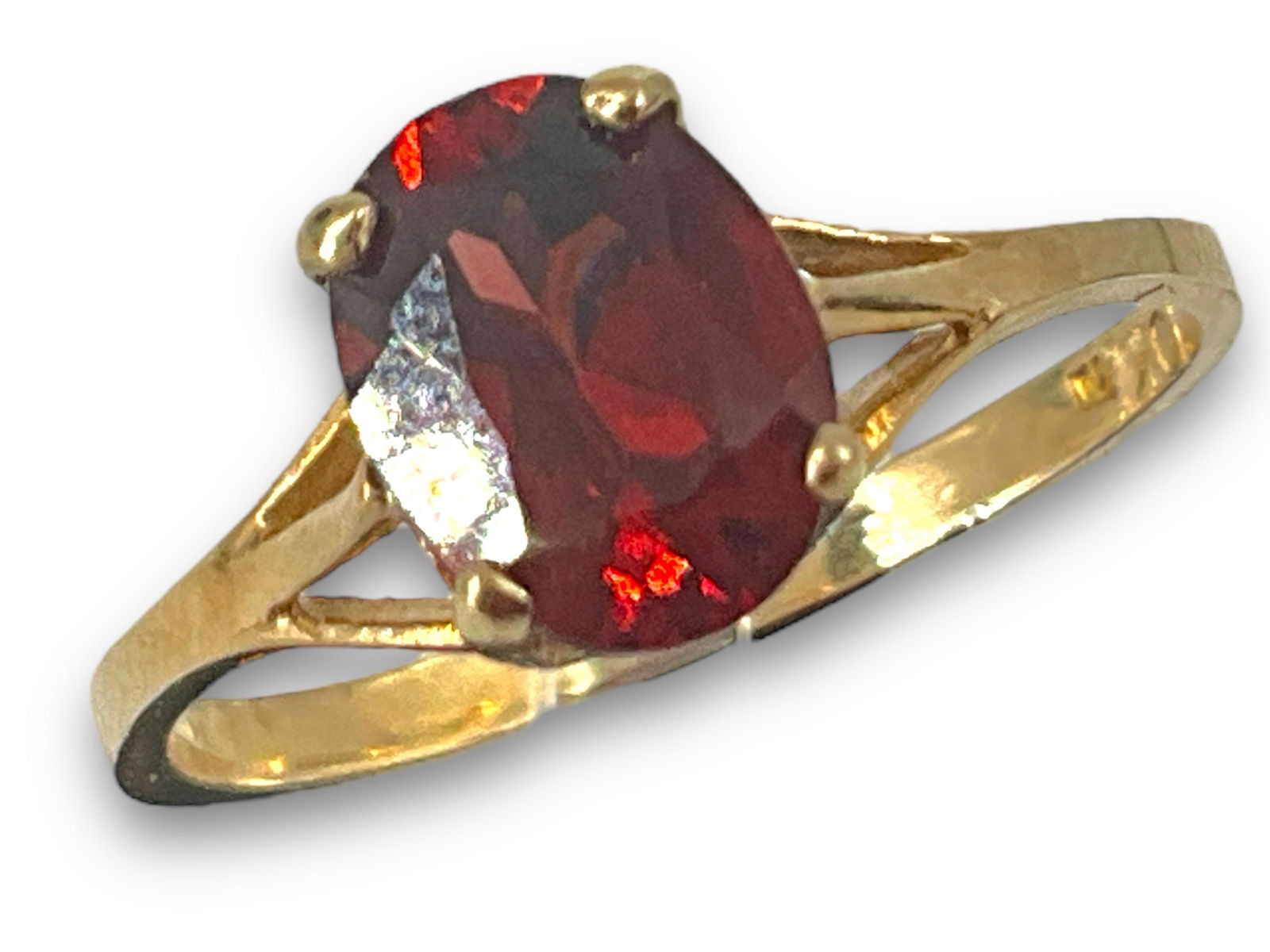 10kt Gold and Garnet Solitaire Ring: 10kt Gold and Garnet Solitaire Ring Stamped and tested 10kt yellow gold, 1.6 grams total weight, size 5.75 with straight shank, ft. 8.0mm x 6.0mm oval cut garnet center stone - approximately 1.4 ctw.