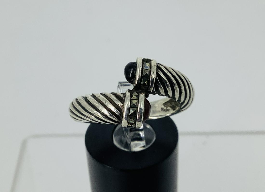 Sterling Silver Ring: Sterling Silver Ring 0.195 troy ounces total weight, size 7.5 with bypass shank, stamped and tested sterling silver/925. Adorned with carnelian and onyx stone - with marcasite decoration.