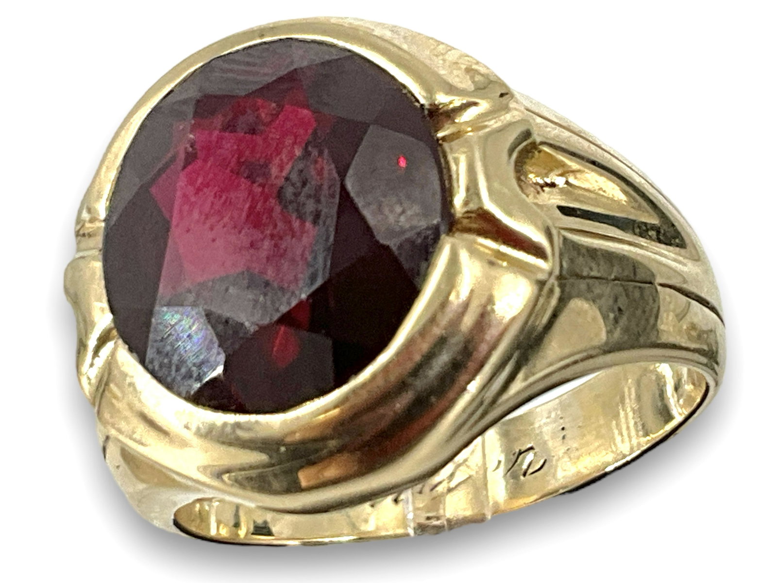 Substantial 10k Synthetic Ruby Ring: Substantial 10k Synthetic Ruby Ring Stamped and tested for 14k gold, this ring weighs a solid 14.4 grams and features a large synthetic bezel set ruby @ 11.8 x 13.3mm. Ring has a name engraved inside
