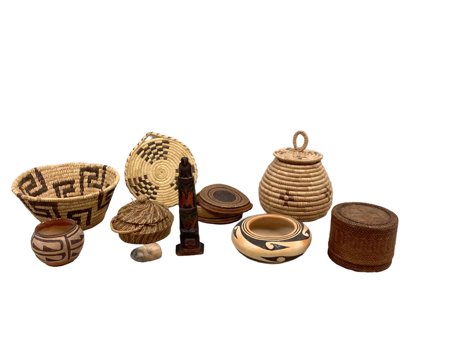 Lot of Native American Items including (6) Baskets, (2) Pots, a Ceramic Pipe, and a Tabletop Totem (1 of 3)