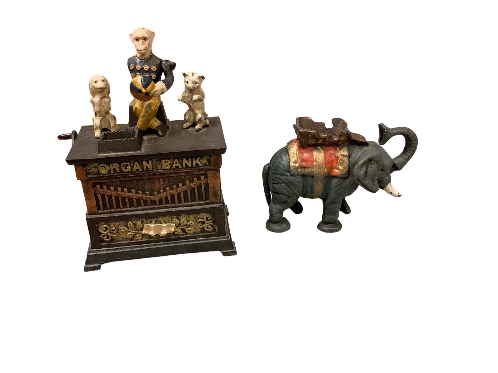 (2) Cast Iron Reproduction Banks: (2) Cast Iron Reproduction Banks Organ Bank 9îH to the top of monkeyís head. 6î W. Elephant 5î H. Monkey has an arm missing.