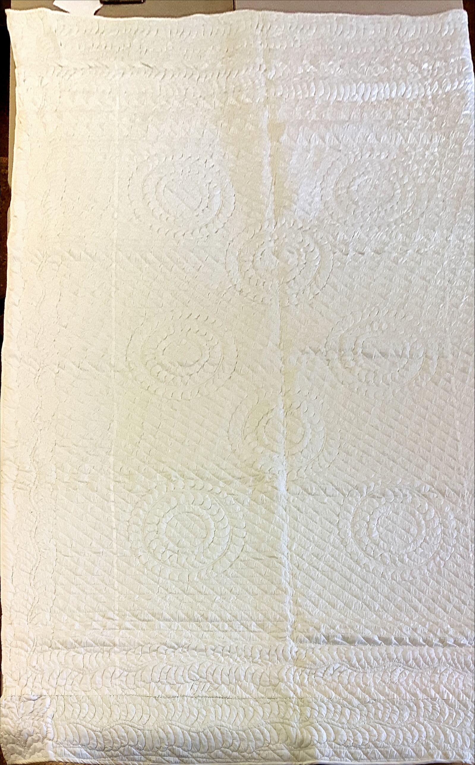 Quilt: Quilt All white with ì1972î embroidered in red on edge, 68î x 105î. No visible spots or tears.