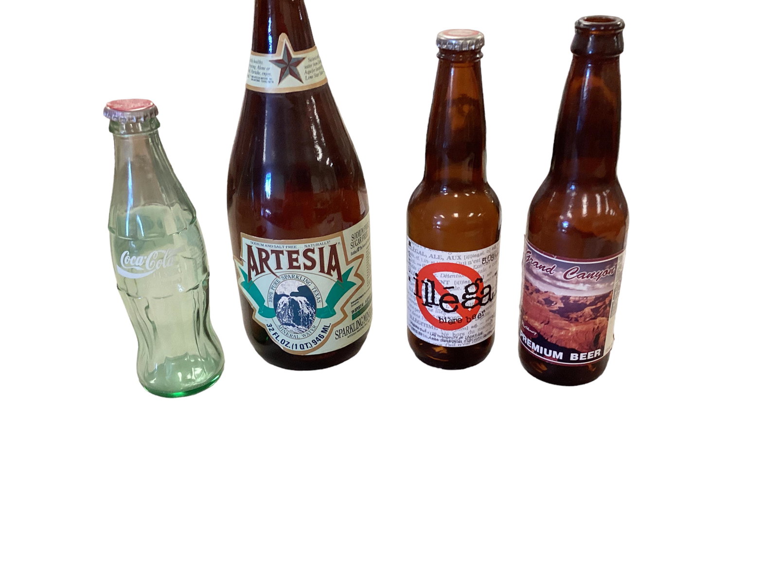 Old Bottles: Old Bottles Artesia. ( pure sparkling water) Illegal beer, Grand Canyon Beer, Coco cola classic.
