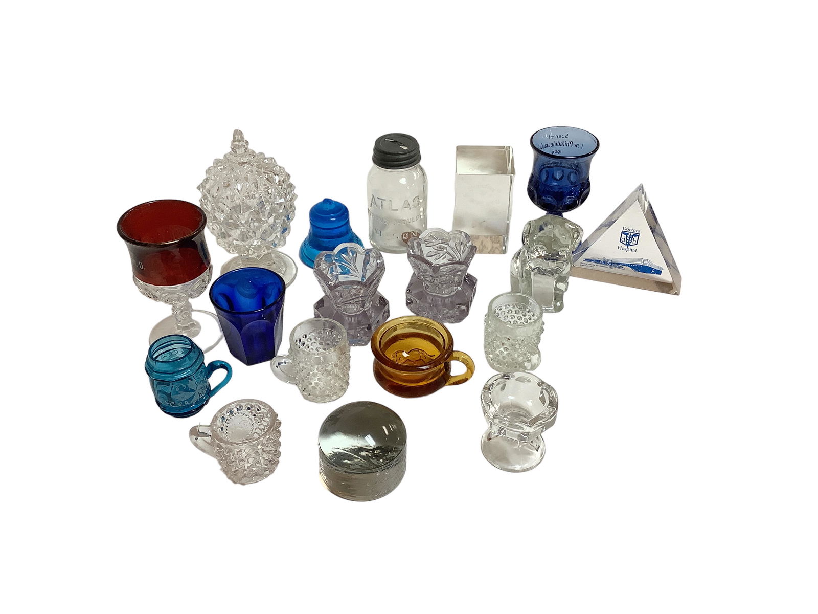 Glass Grouping Including Toothpick Holders, Paperweights, Souvenir Glasses & More: Glass Grouping Including Toothpick Holders, Paperweights, Souvenir Glasses & More Total of 18 pieces. Lavender toothpick holders (2), Atlas Strong Shoulder Mason 4î bank, pineapple covered candy