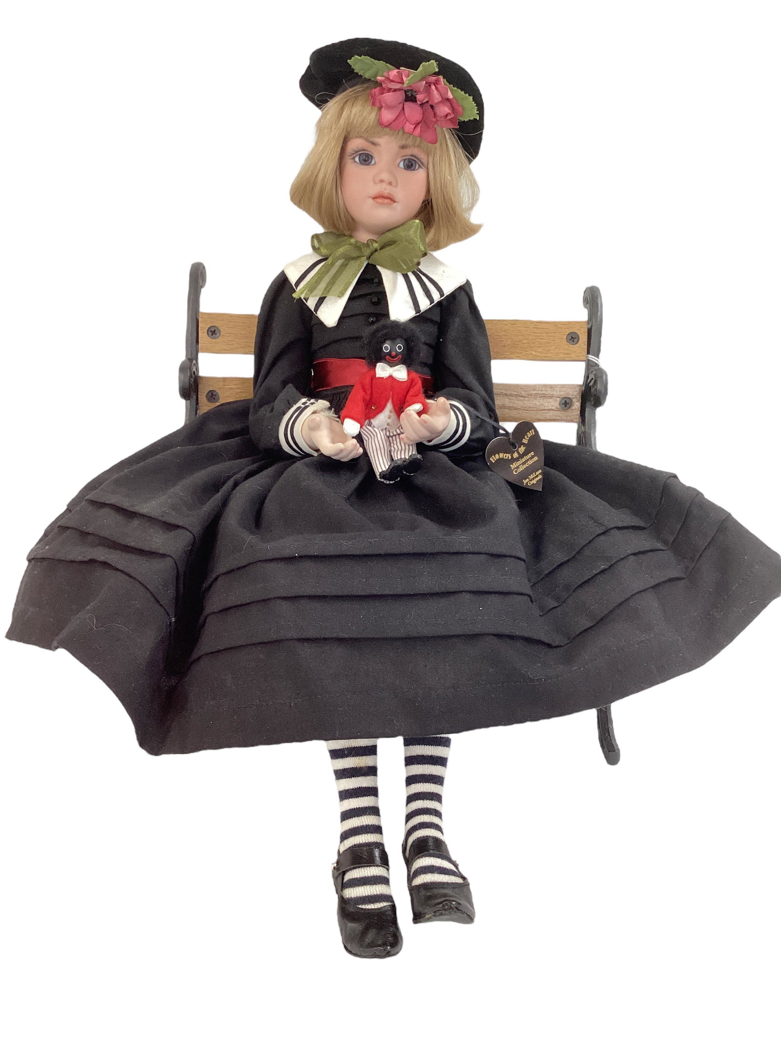 Pansy II by Doll Artist Jan McLean: Pansy II by Doll Artist Jan McLean 17" all porcelain seated doll with human hair wig, inset glass eyes, closed mouth, jointed at the neck, shoulders and hips, costumed in black cotton dress with white