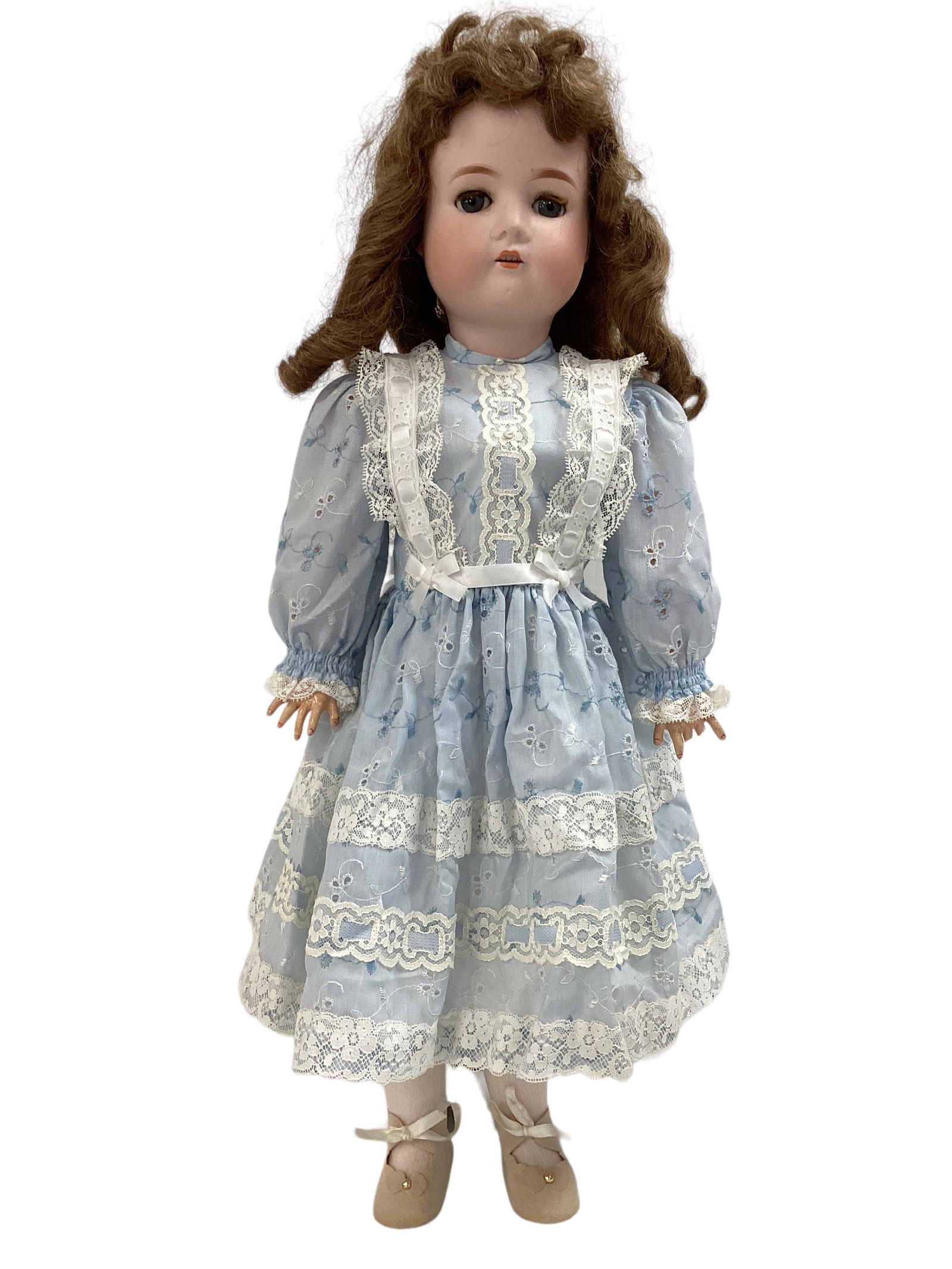 Dressel Bisque Socket Head Girl: Dressel Bisque Socket Head Girl 22" doll marked 1912-4, replaced wig, glass sleep eyes with eyelashes, open mouth with teeth, on jointed composition body. Minor bisque chips at base of neck, wig glued