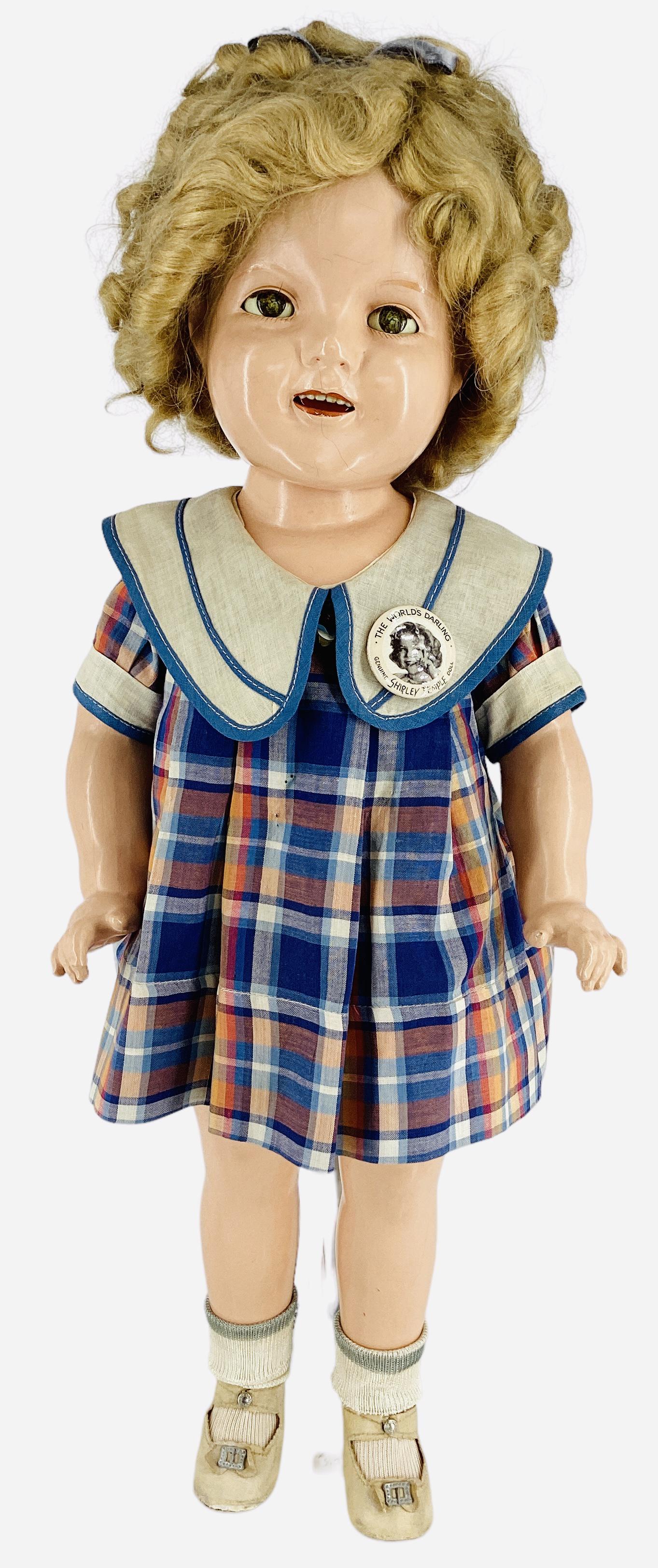 Ideal Composition Shirley Temple Doll: Ideal Composition Shirley Temple Doll 21" doll with mohair wig in original set, sleep eyes, open mouth with teeth, on five-piece body. Shirley wears her original tagged dress, undergarments, center sn